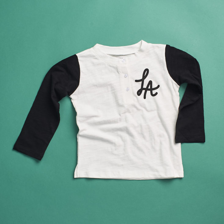 A black and white baseball tee with "LA" on the chest from Little Starters, size 3T