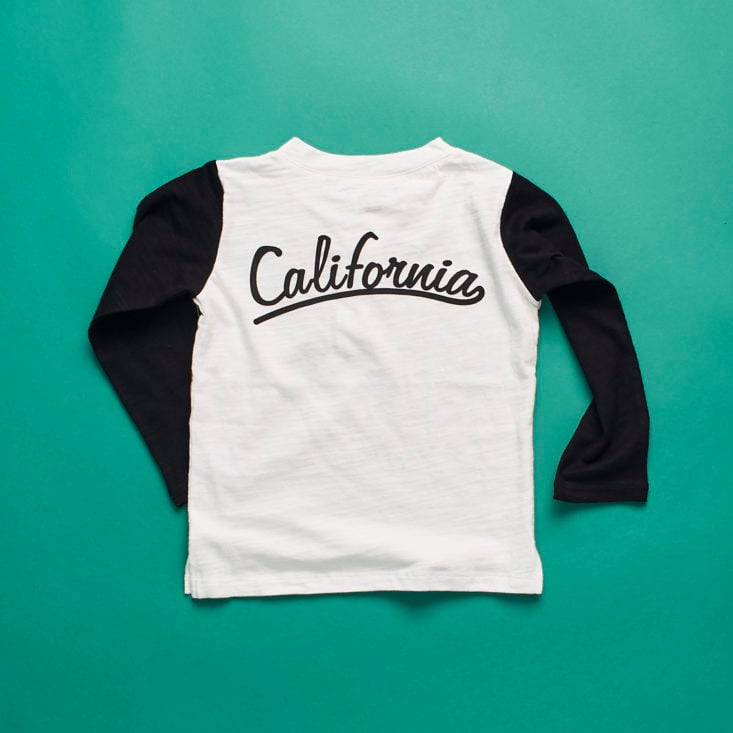 Detail of "LA" baseball tee with "California" in script across the back