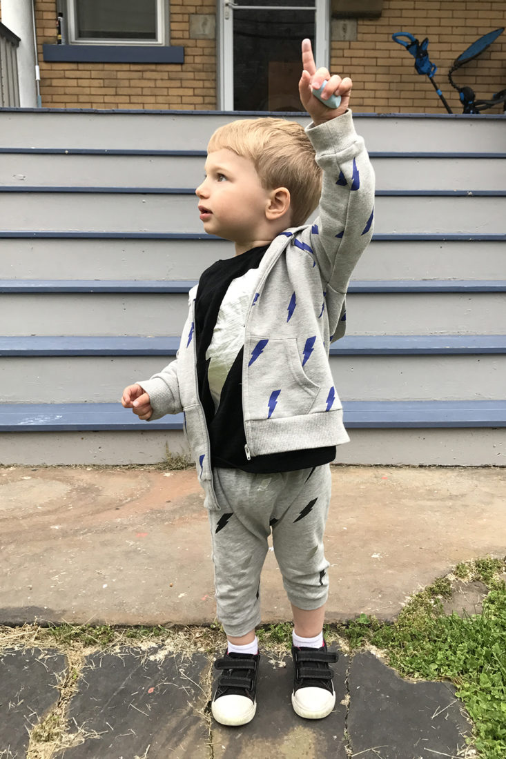 2-year old wearing lightning bolt pants, shirt, and sweatshirt from Little Starters