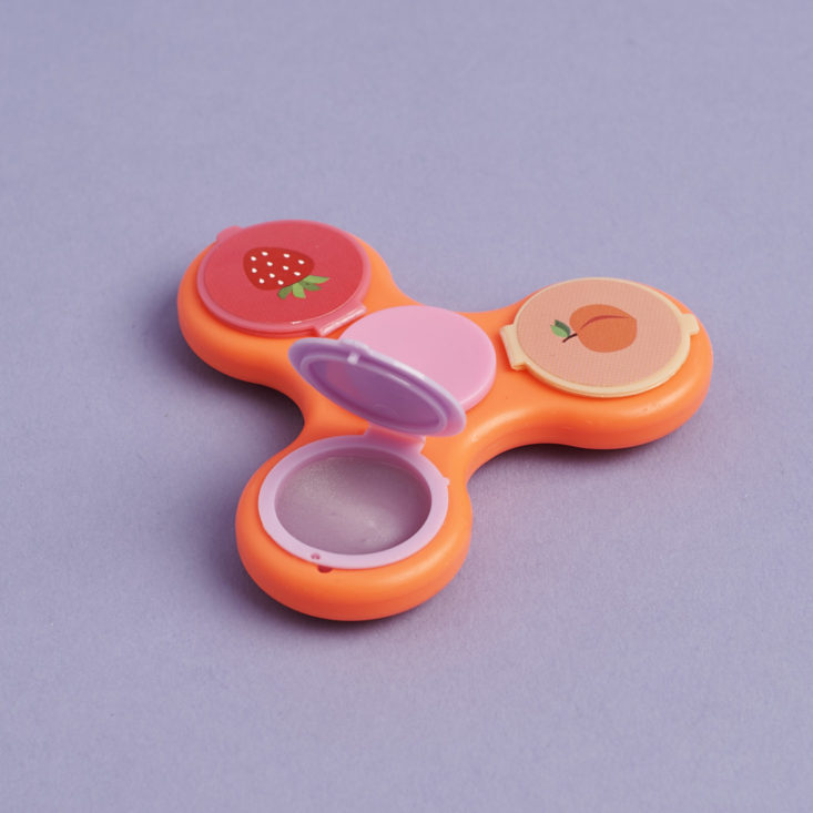 Glamspin fidget spinner lip gloss with one lip gloss open