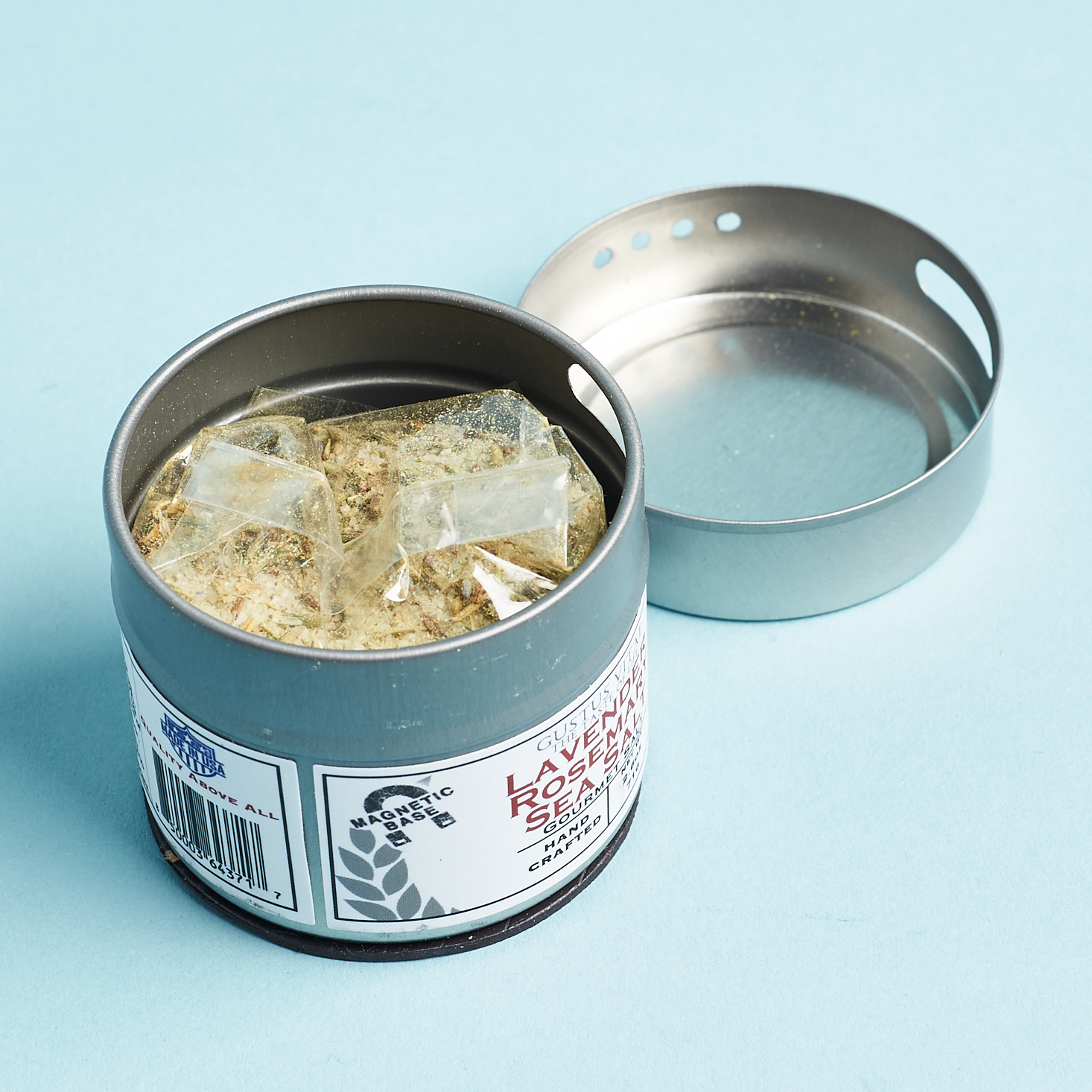 open salt tin, showcasing the salt in a protective clear bag