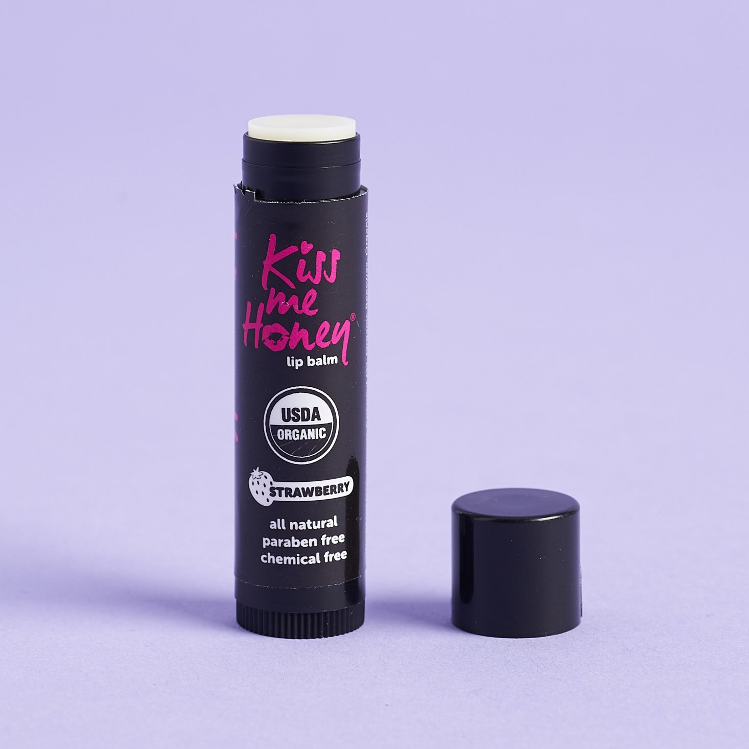 Kiss Me Honey Lip Balm in Strawberry with lid off