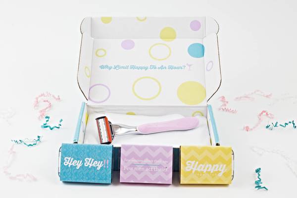 Open Happy Legs Club Box with razor inside and three blade packs in front