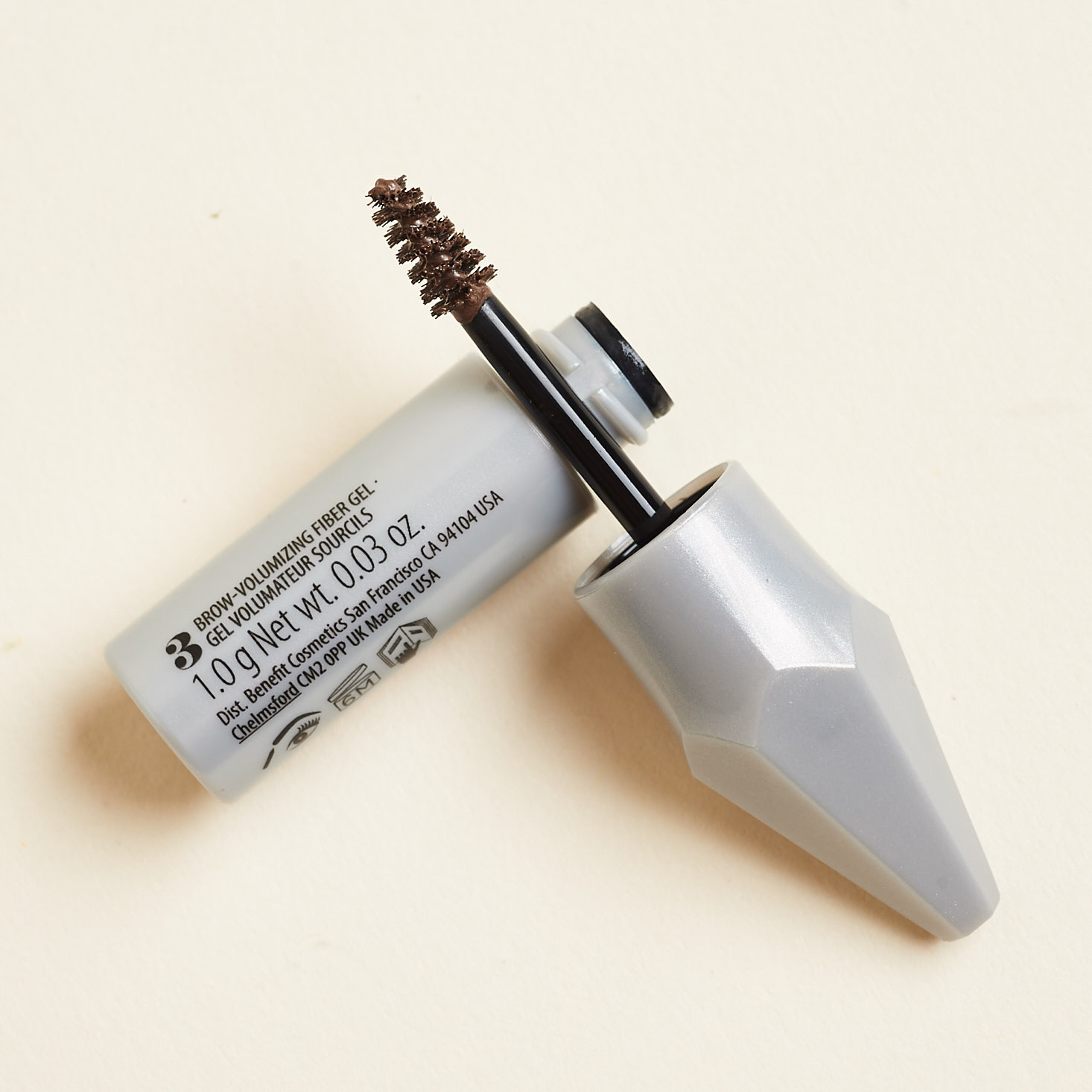 open gimmie brow container displaying mini spoolie applicator tip