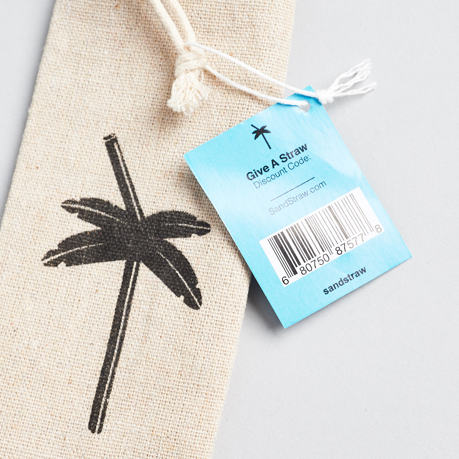 close up of tag for Sand Straw 2-pack with brush