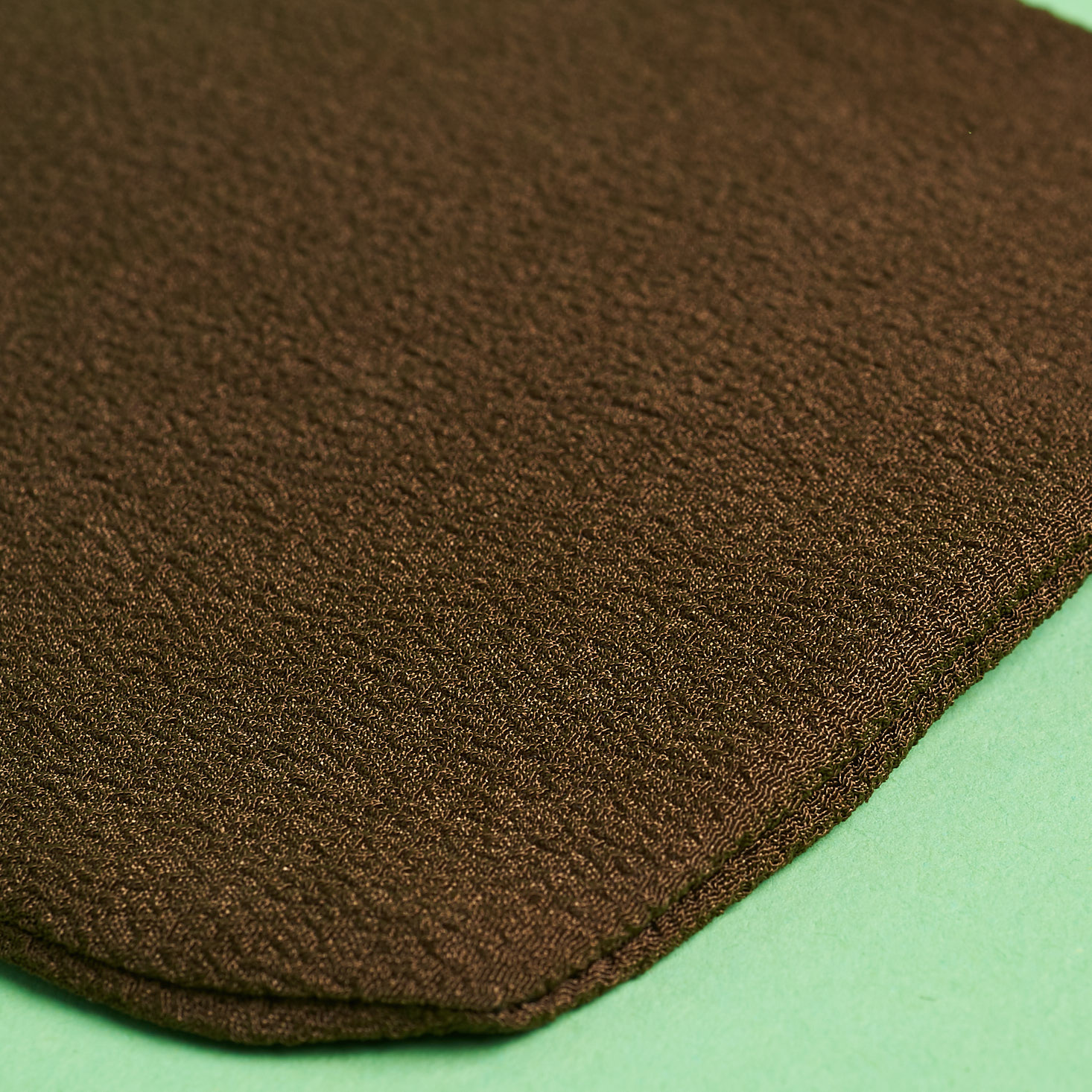 close up of TanOrganic tan-erase ultimate exfoliator glove
