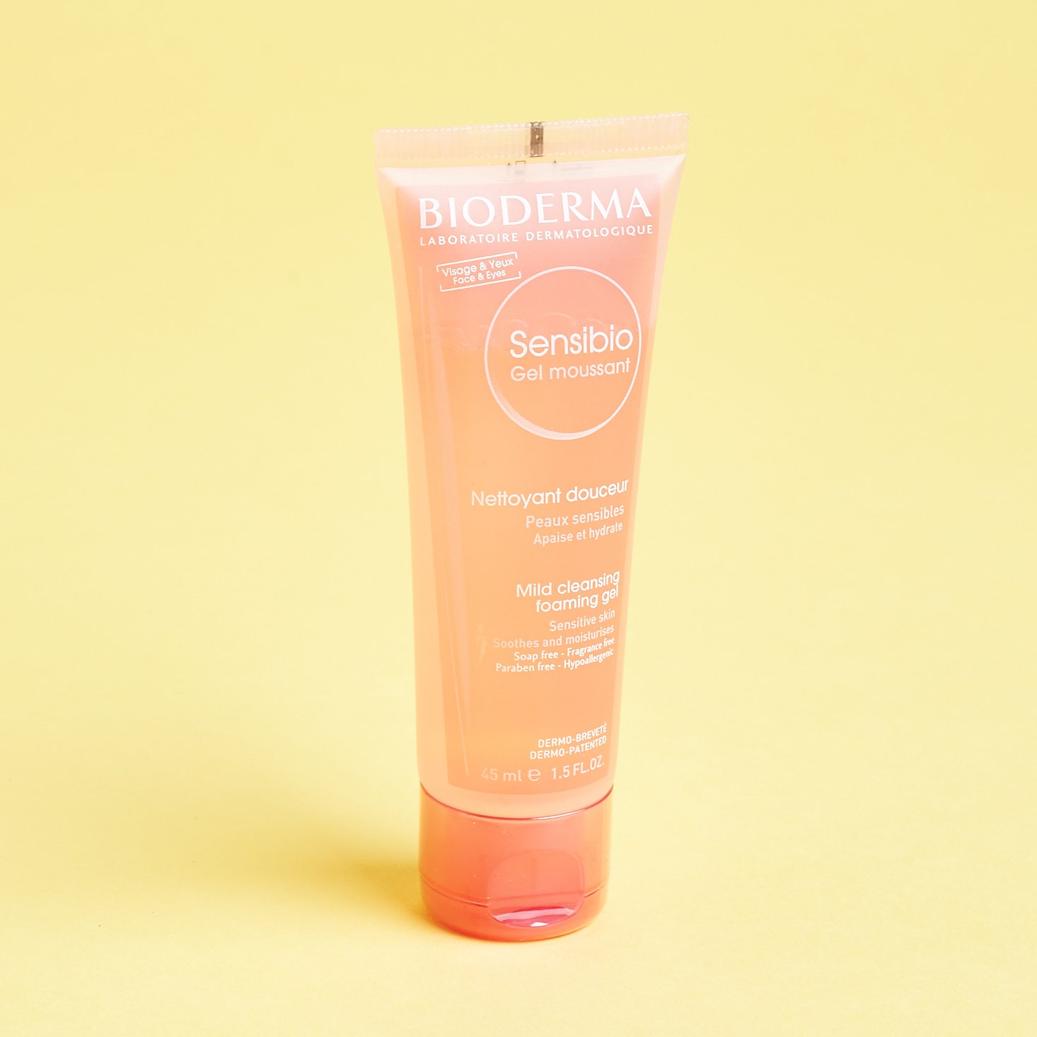 tube of light pink face wash with hot pink cap