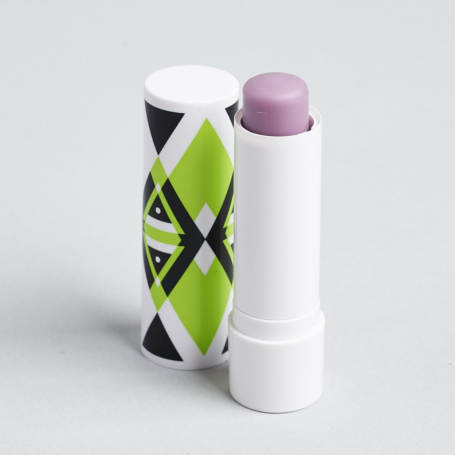 Open Arrow Boost Color Enhancing Lip Balm in Berry Busy with lid off