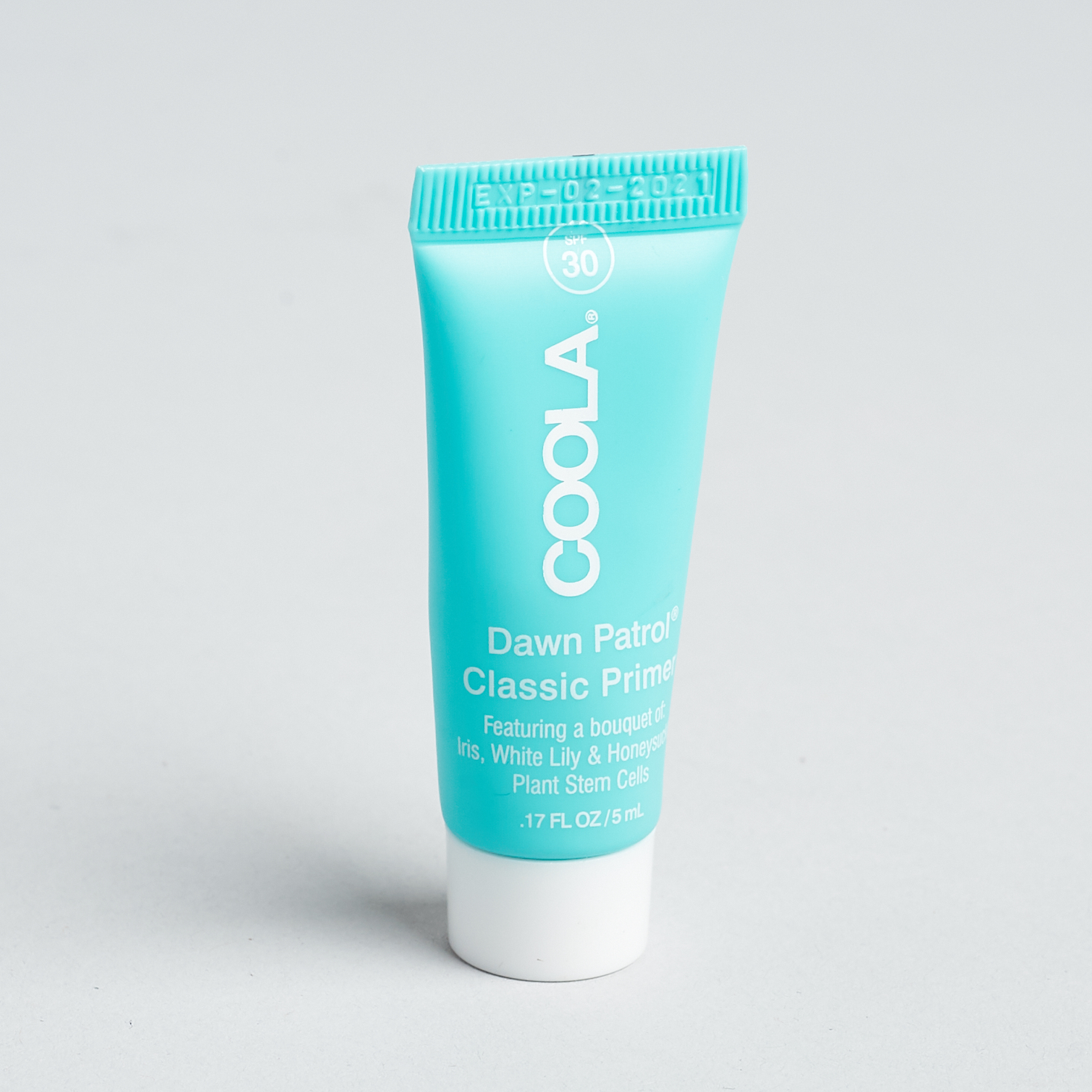 small teal tube of coola primer