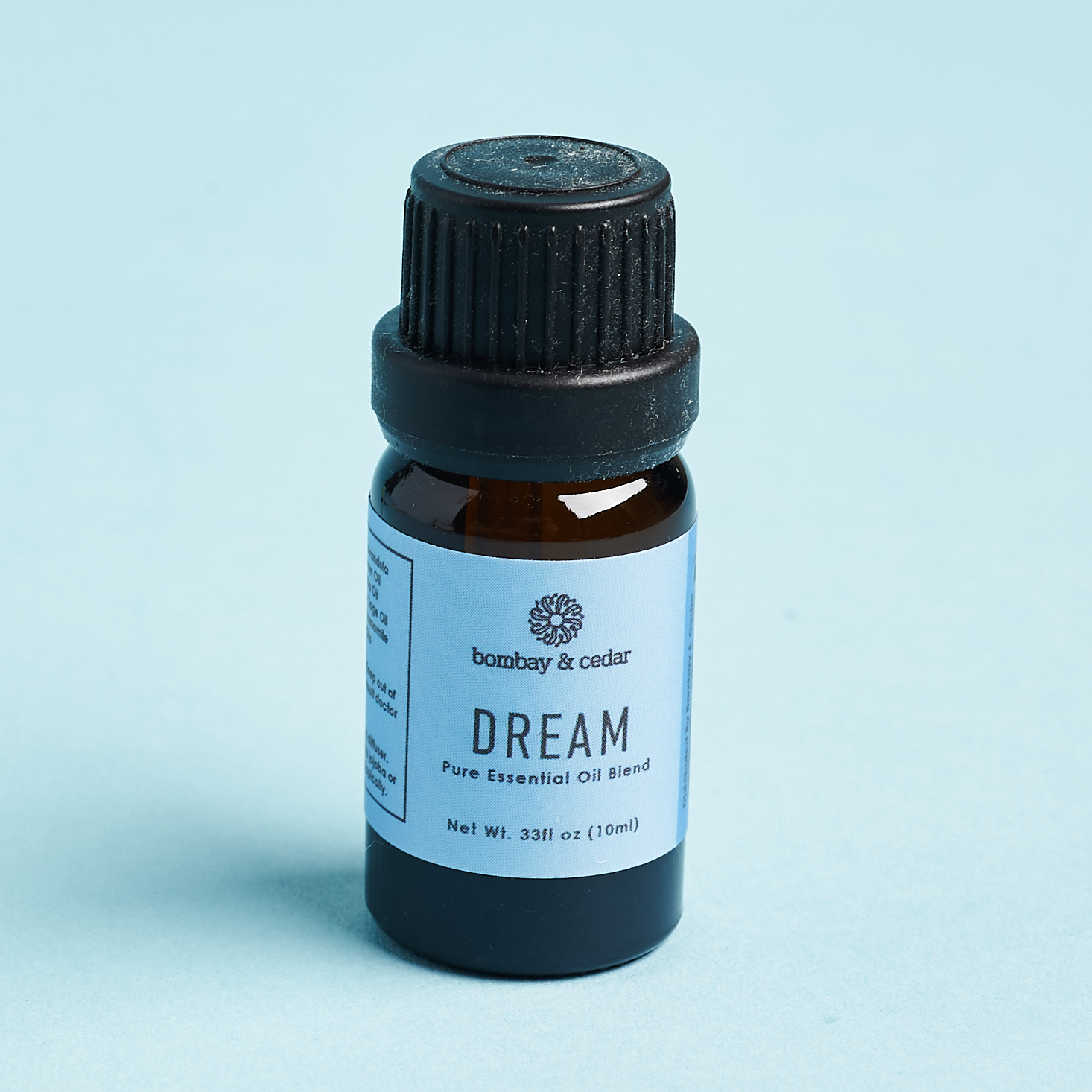 dream essential oil vial with blue label
