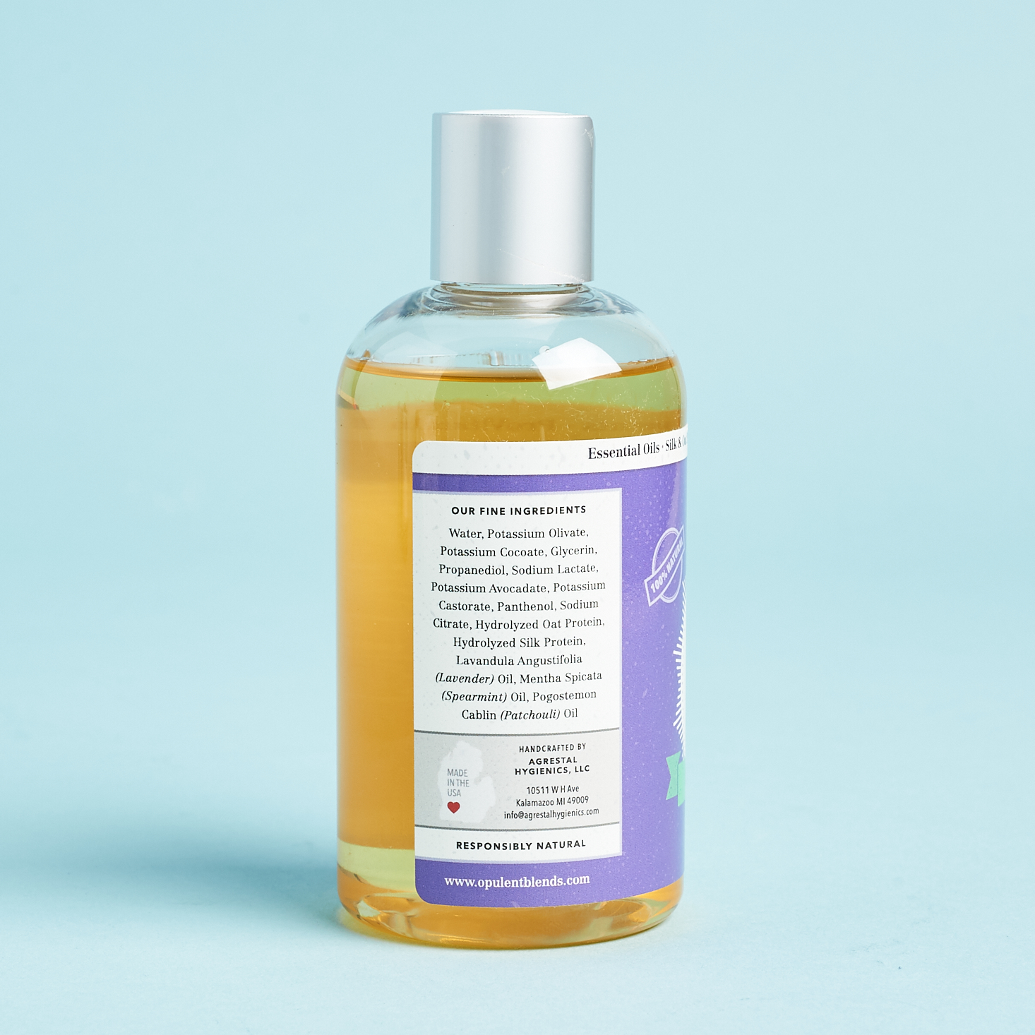 side view of bodywash botle showcasing label