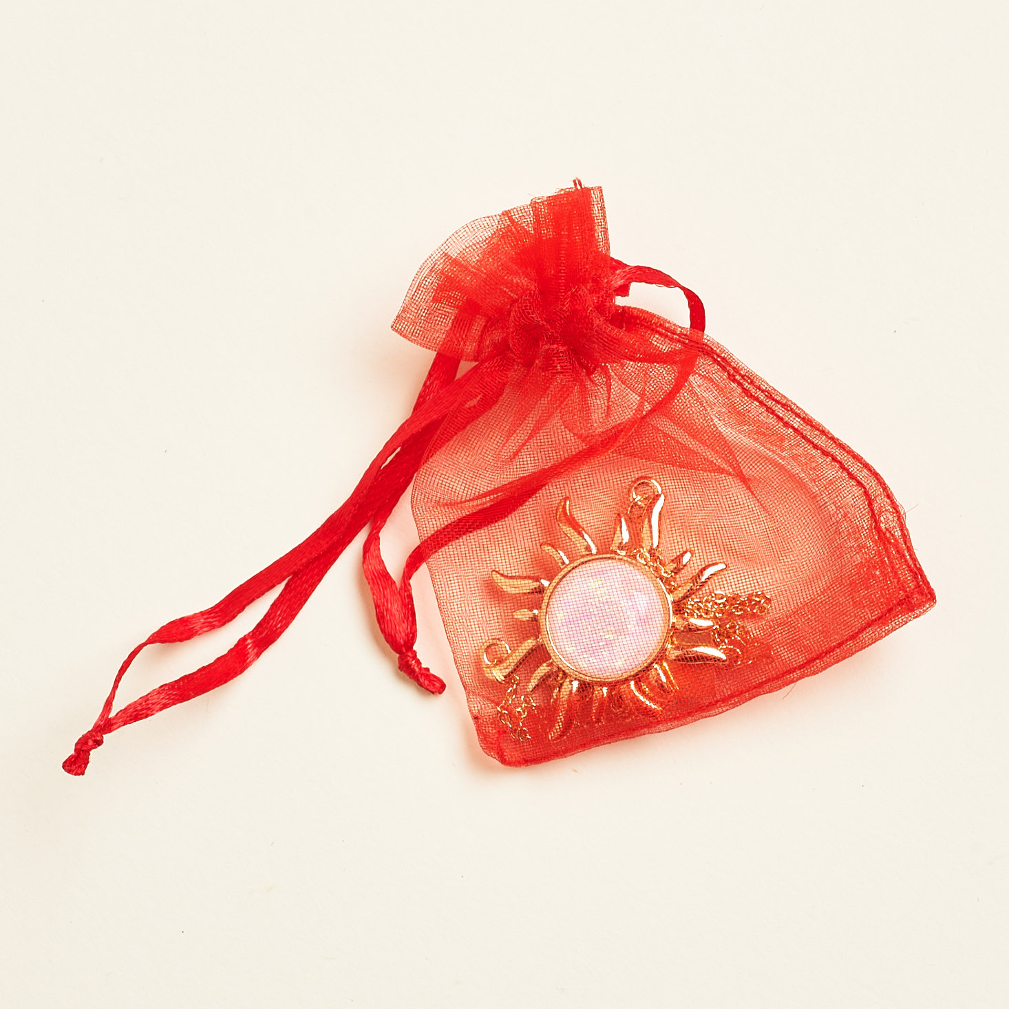 red pouch with necklace inside