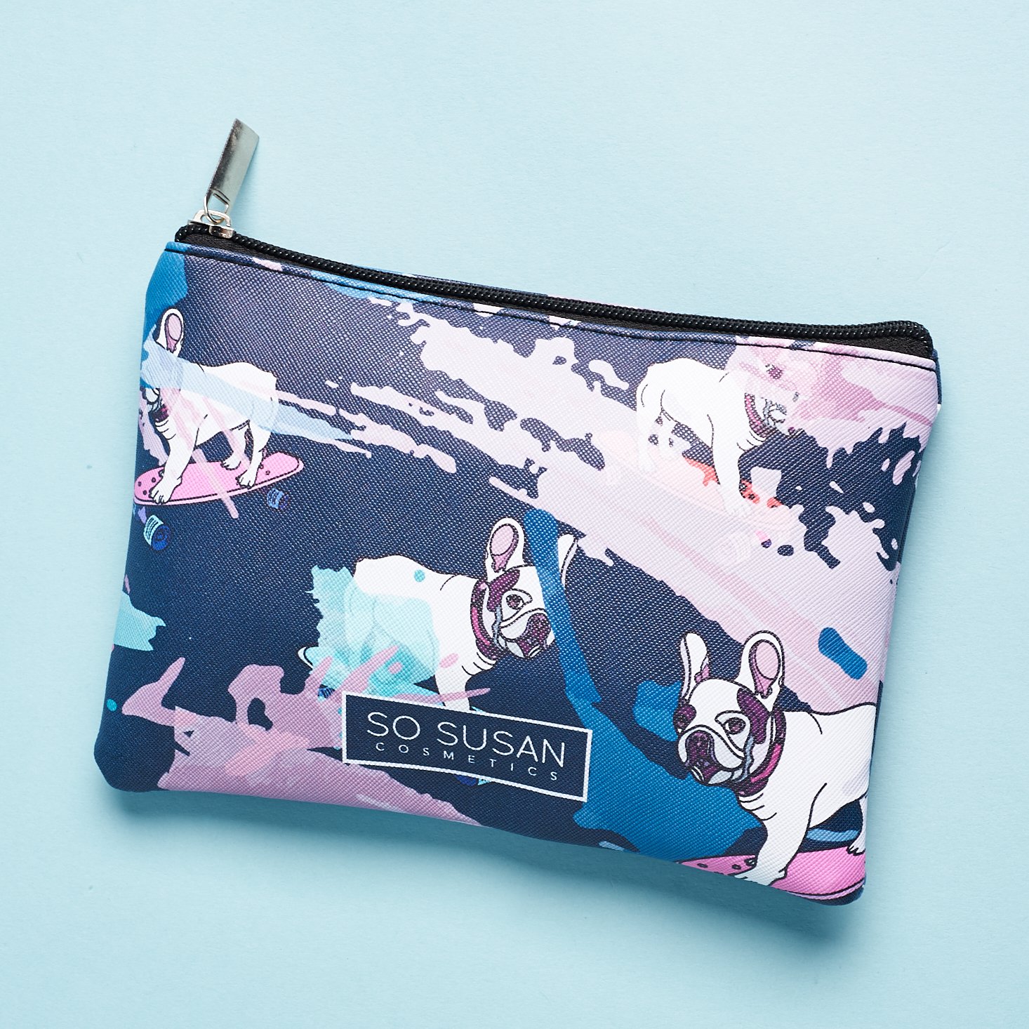 cute pouch with paint splotches and french bulldog on skateboard