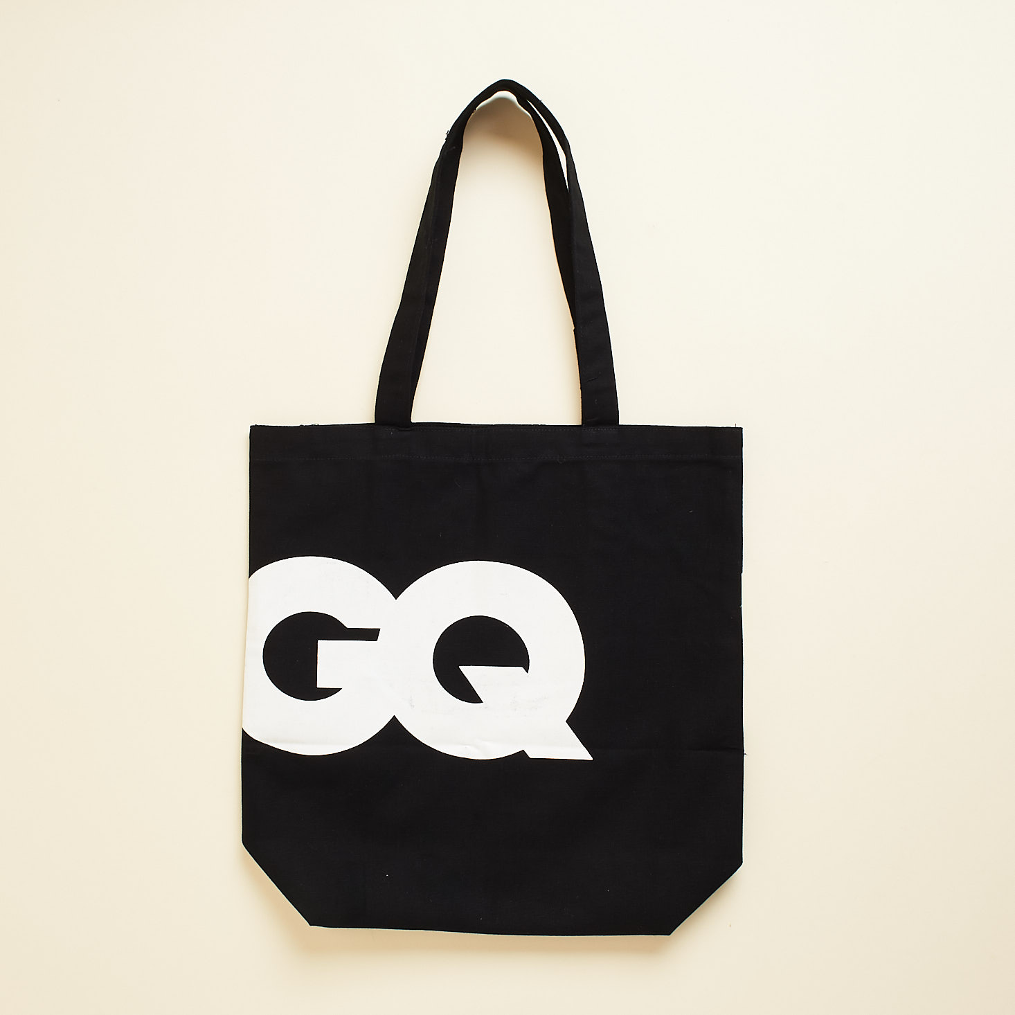 GQ black canvas tote with large white GQ logo