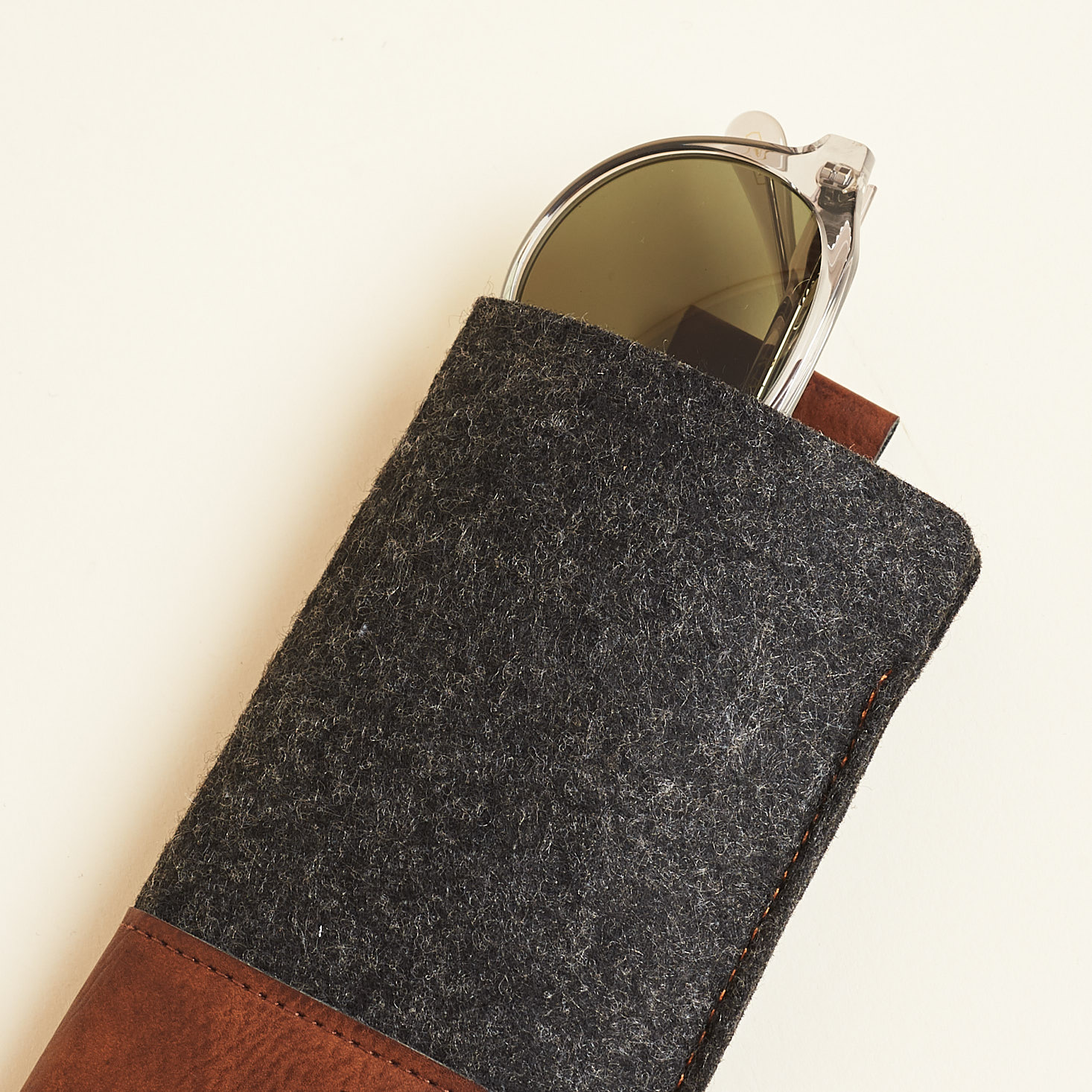 sunglasses tucked into felt holder