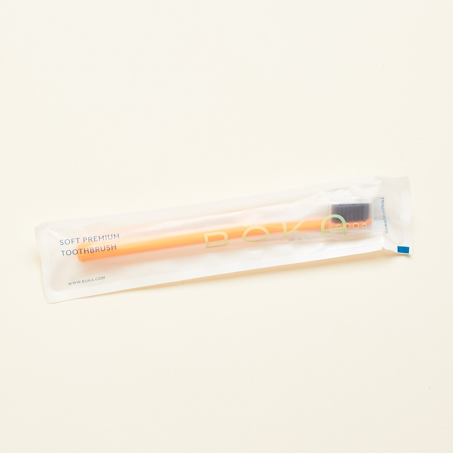 orange boka toothbrush in packaging