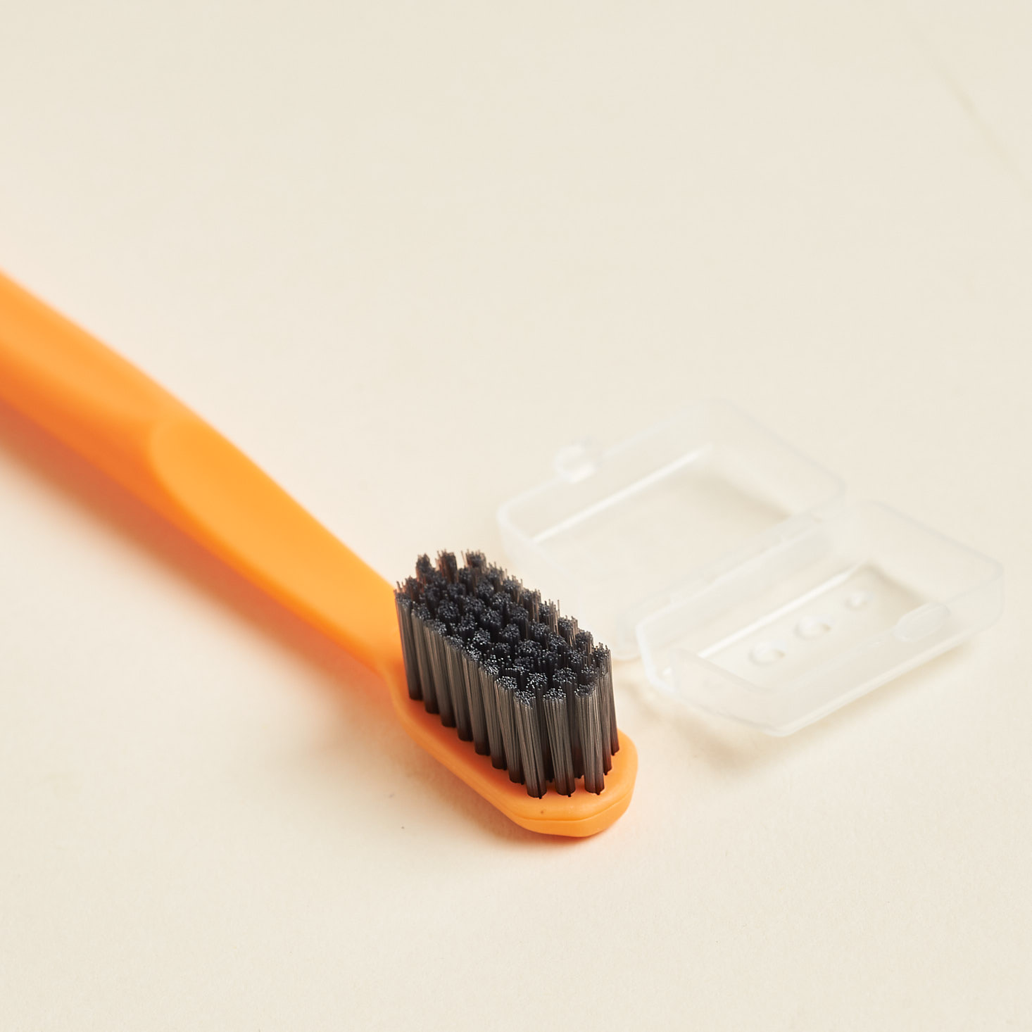 charcoal bristles on boka toothbrush and tiny brush keeper