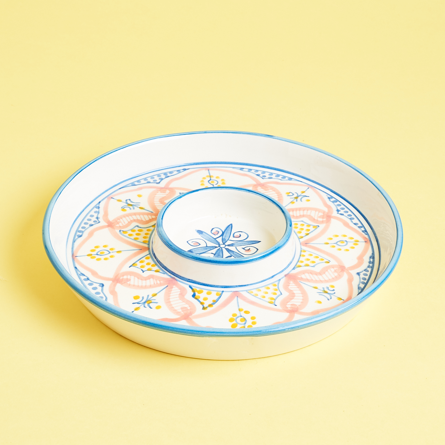 mezze plate with blue, pink, yellow, and white design
