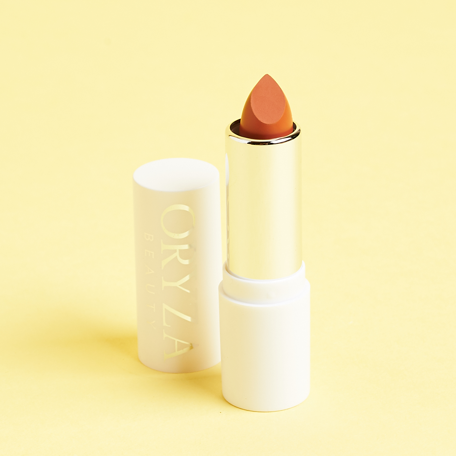 white tube of tan colored lipstick