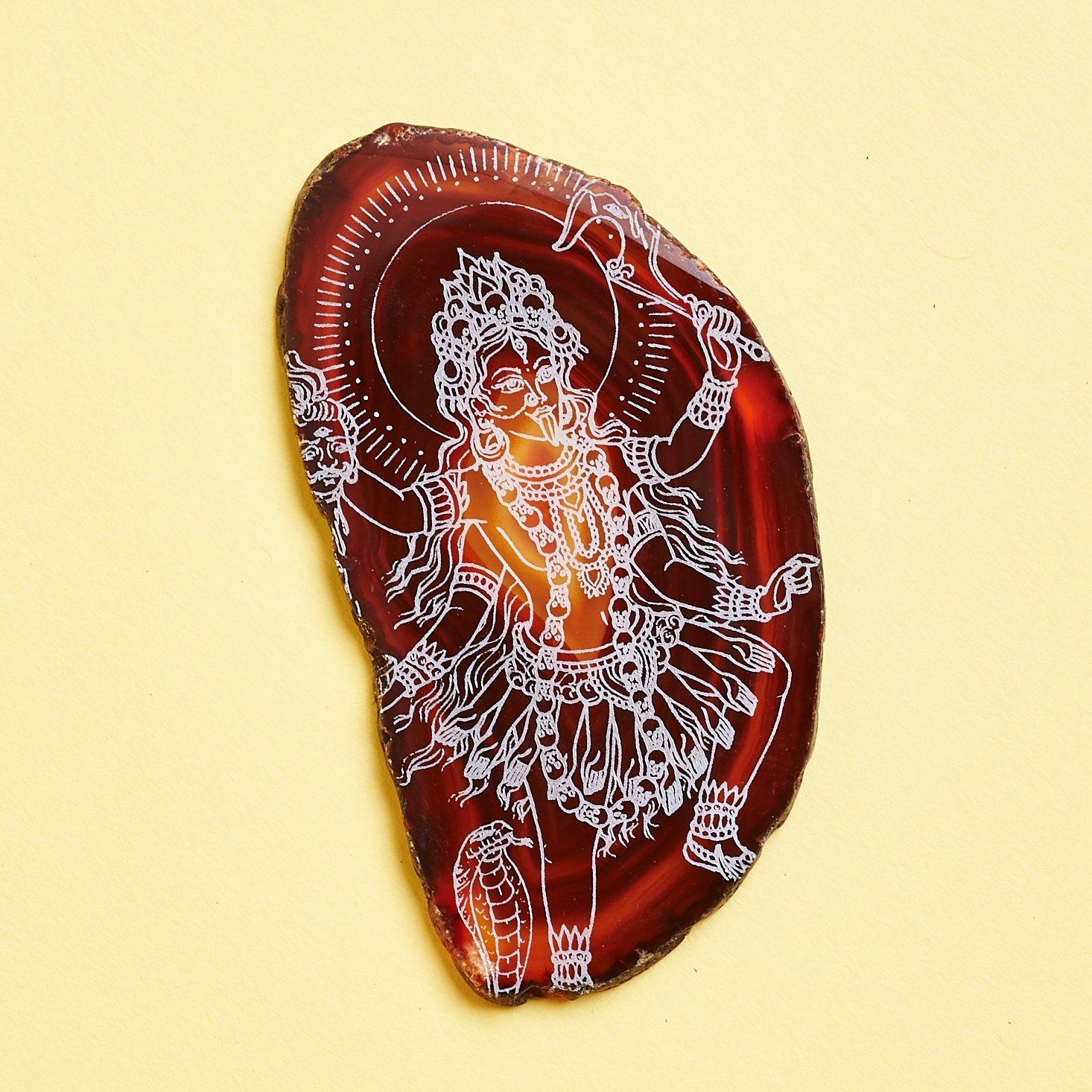 kali carved into agate stone