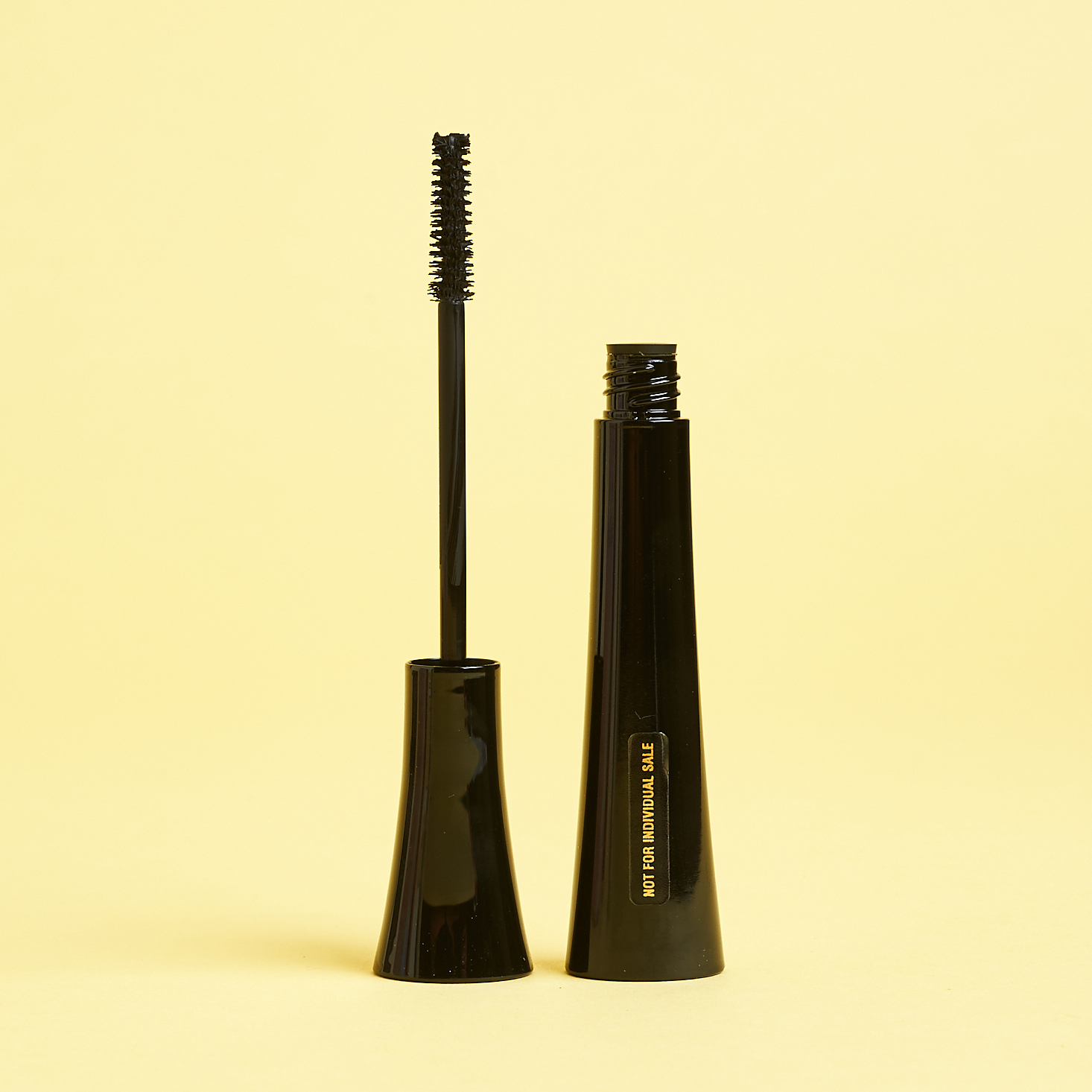 open mascara tube showing brush