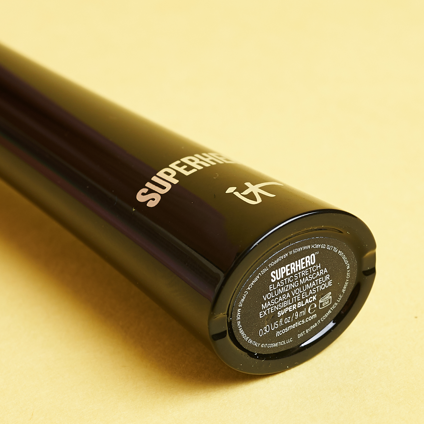 bottom of solid black mascara tube with info sticker