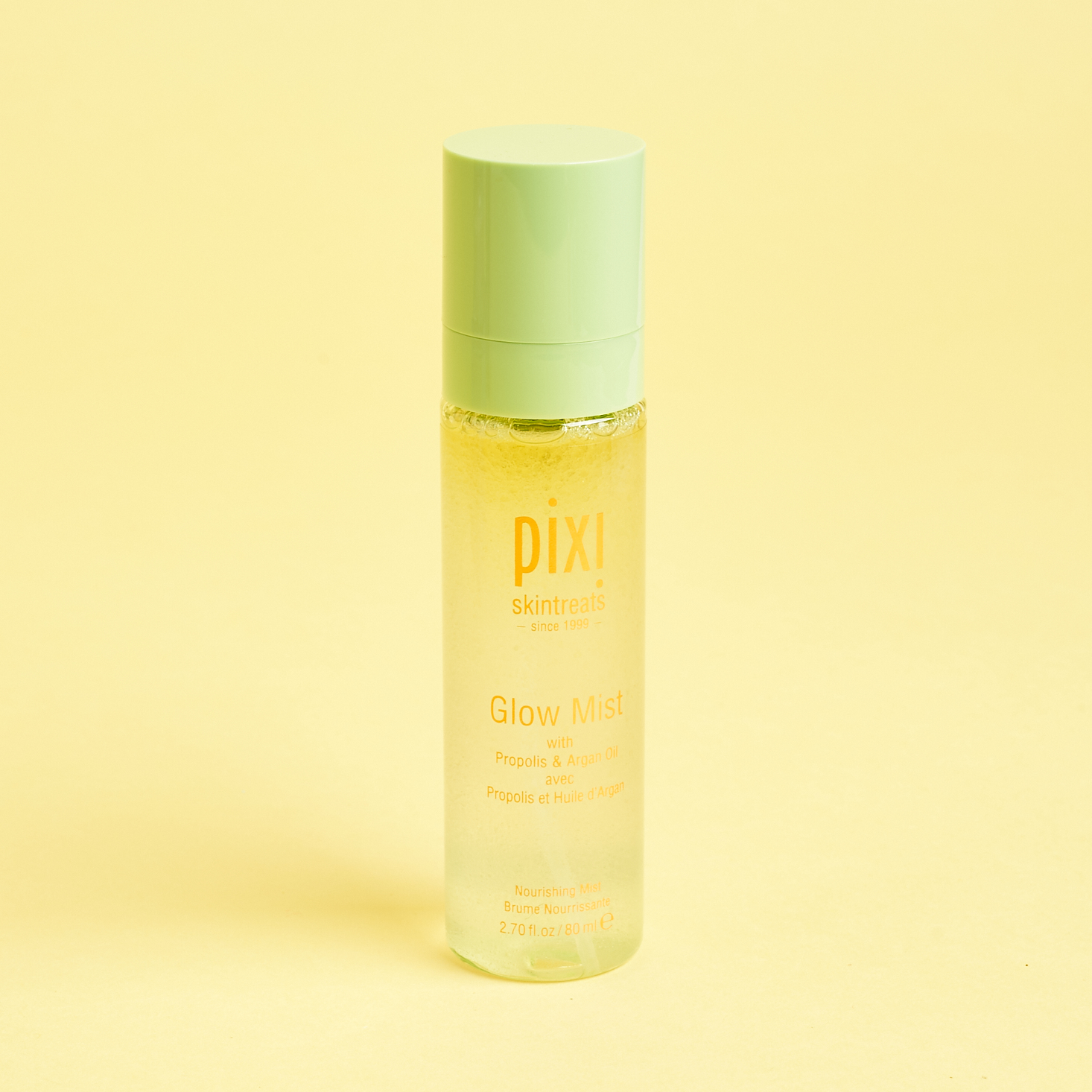 clear bottle of pixie glow serum with green lid