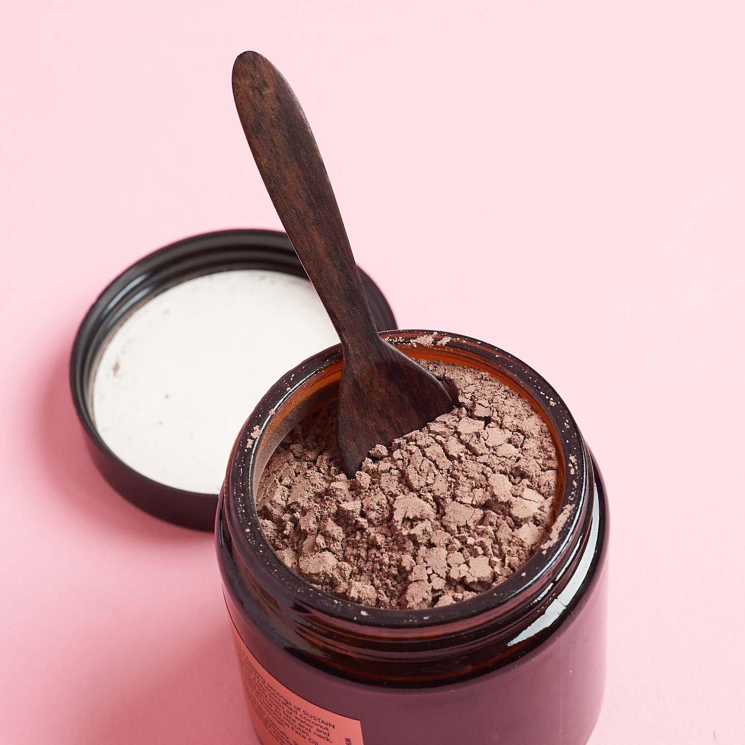 Lanima Skin Sustain Refining Clay Mask with lid off and spoon stuck in powder