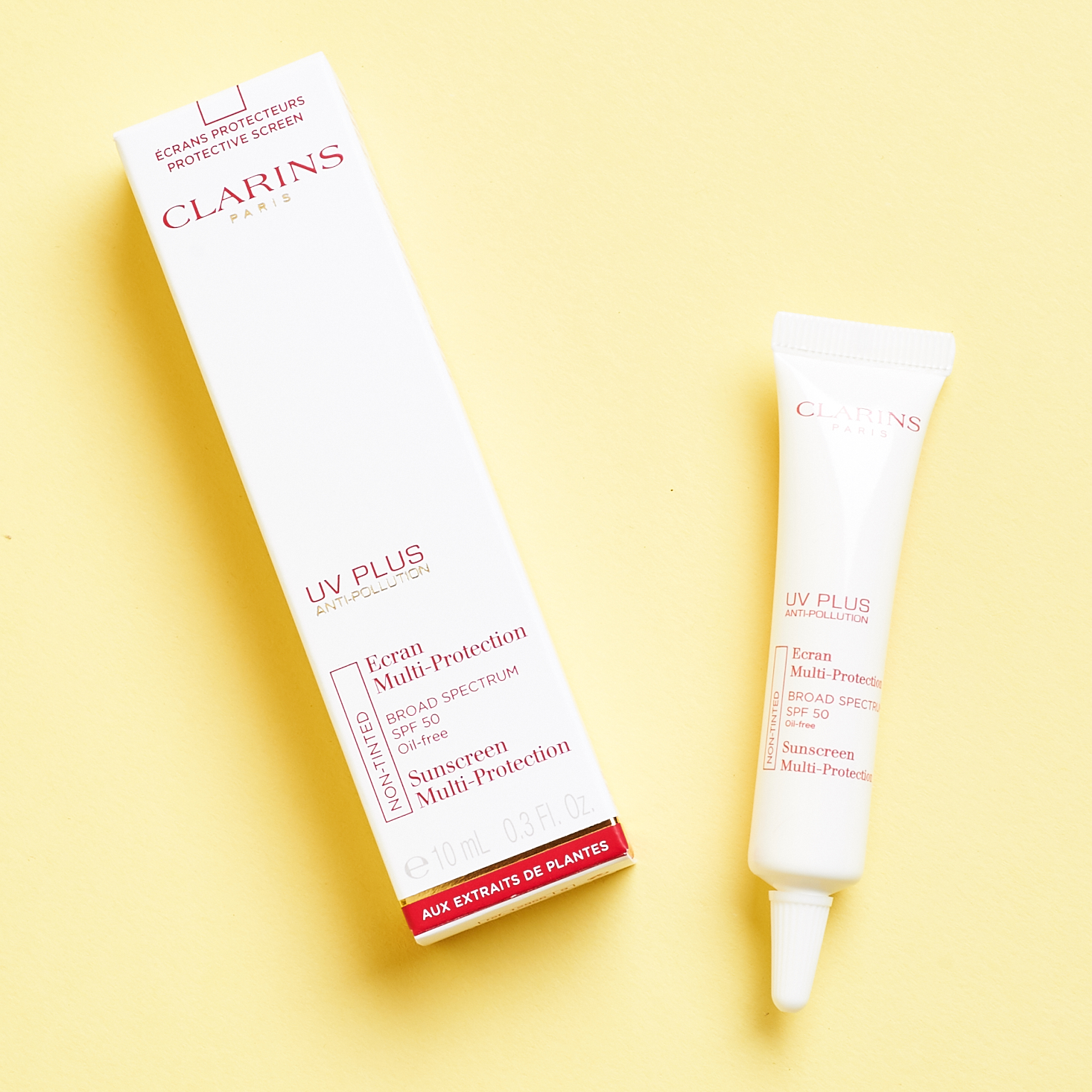 white and red tube of clarins sunscreen cream