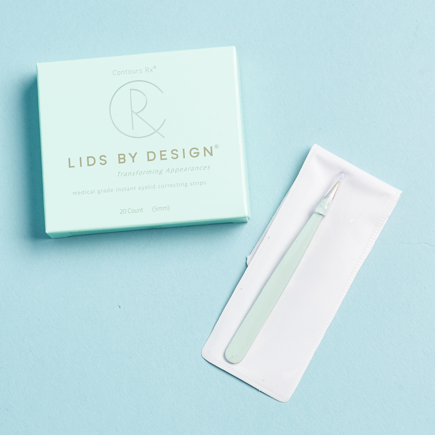 lids by design pale blue box and tweezers