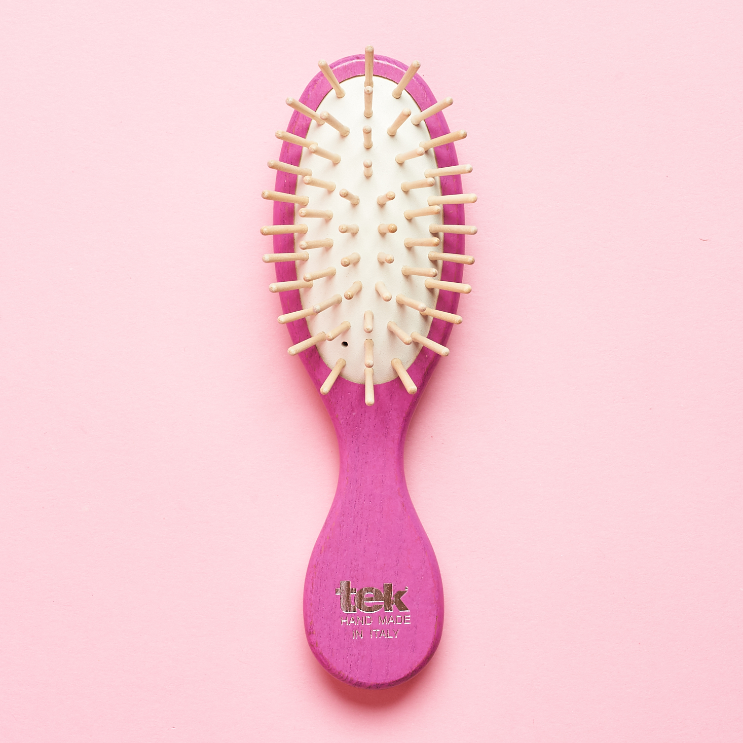 straight on view of TEK SMALL FUCHSIA PURSE BRUSH