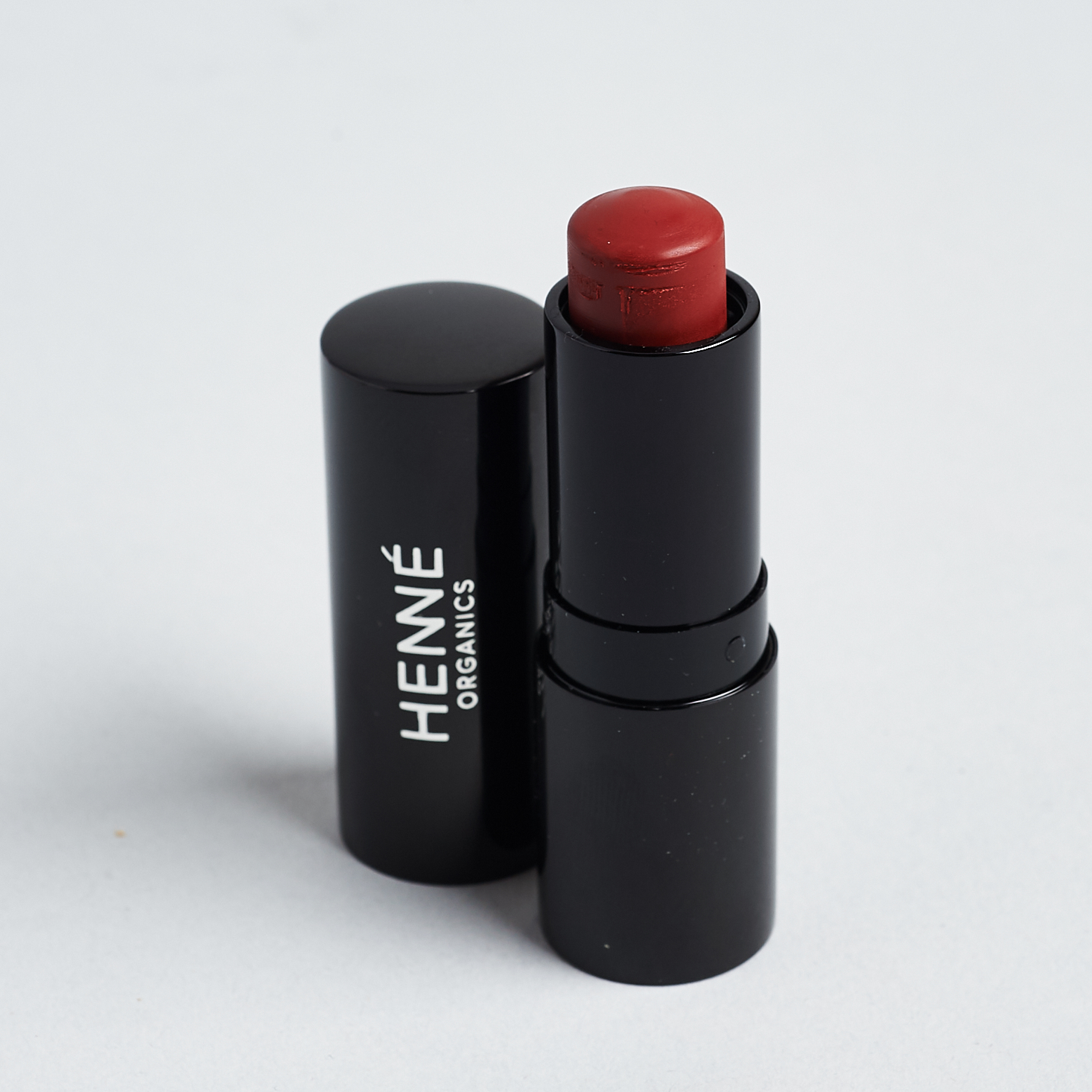 Henne Organics Luxury Lip Tint in "Intrigue" with lid off