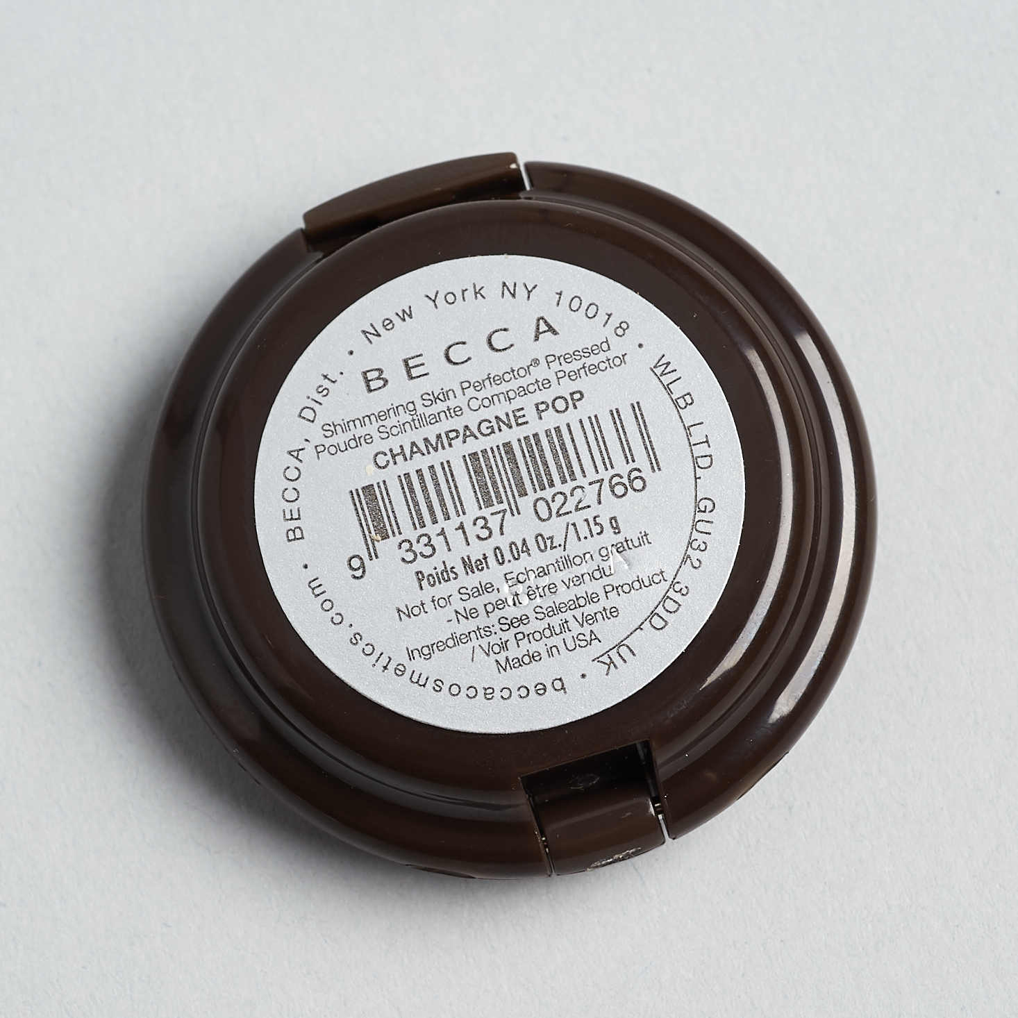 bottom of becca compact with info sticker