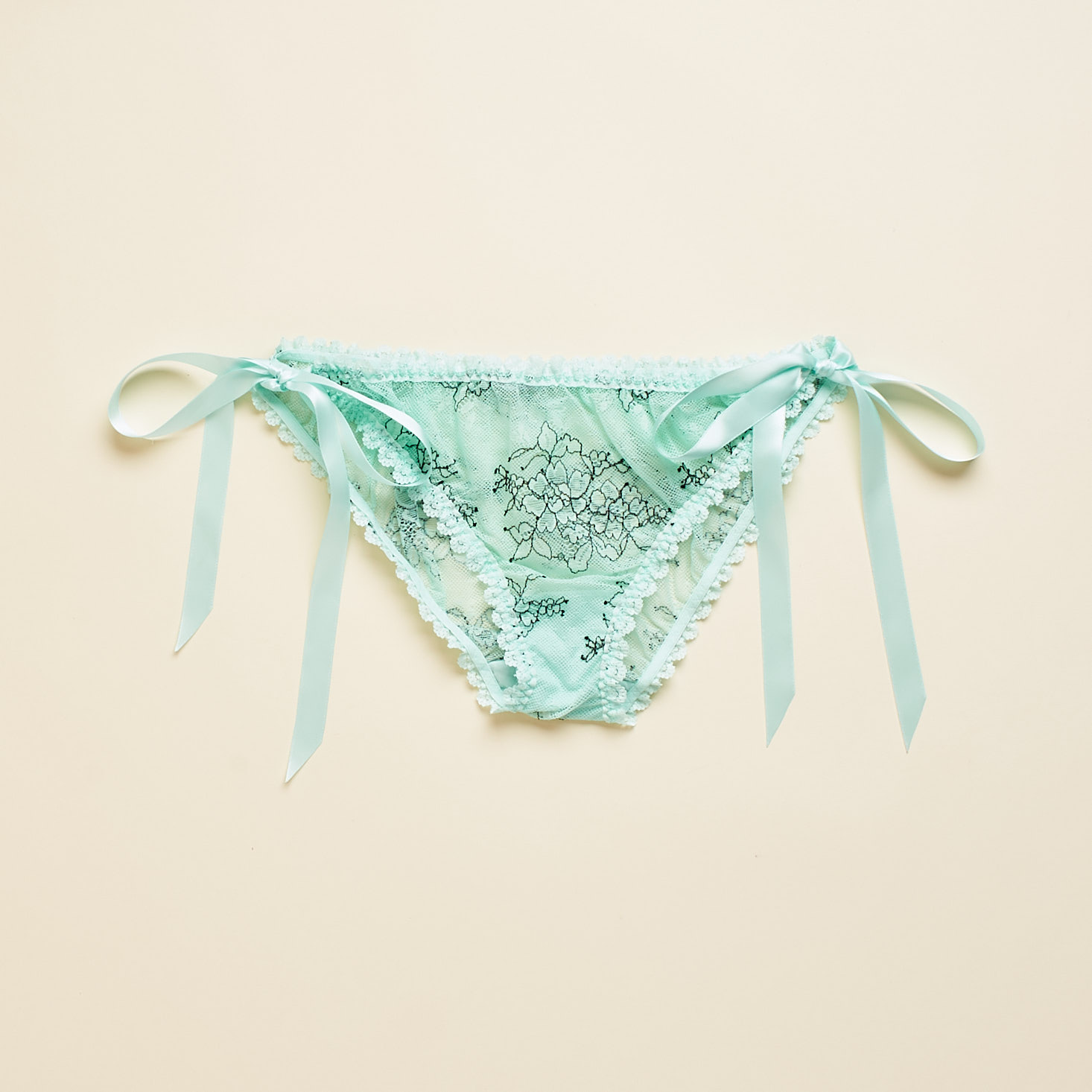 lacy turquoise panty with ribbon ties at each hip