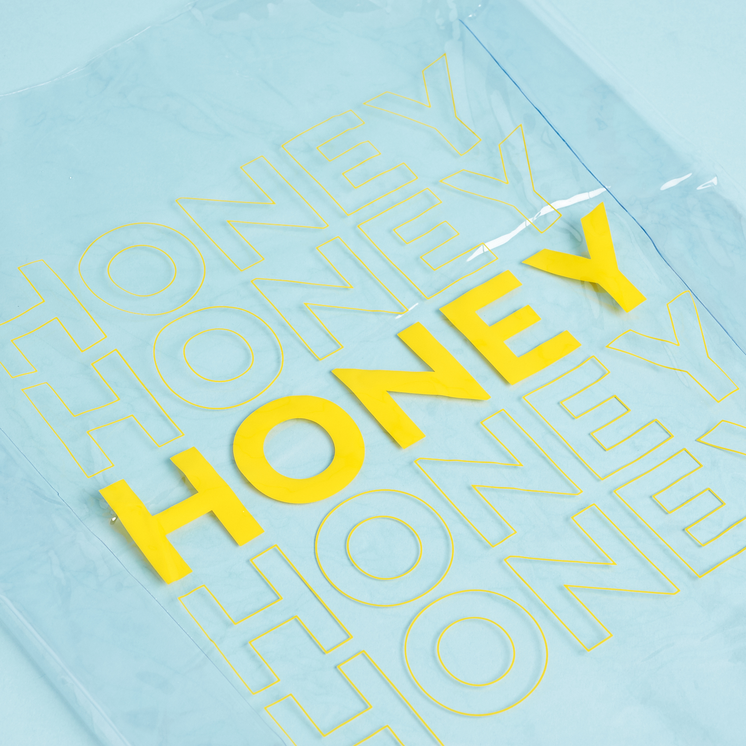 close up of SlutBox Clear "honey" tote bag