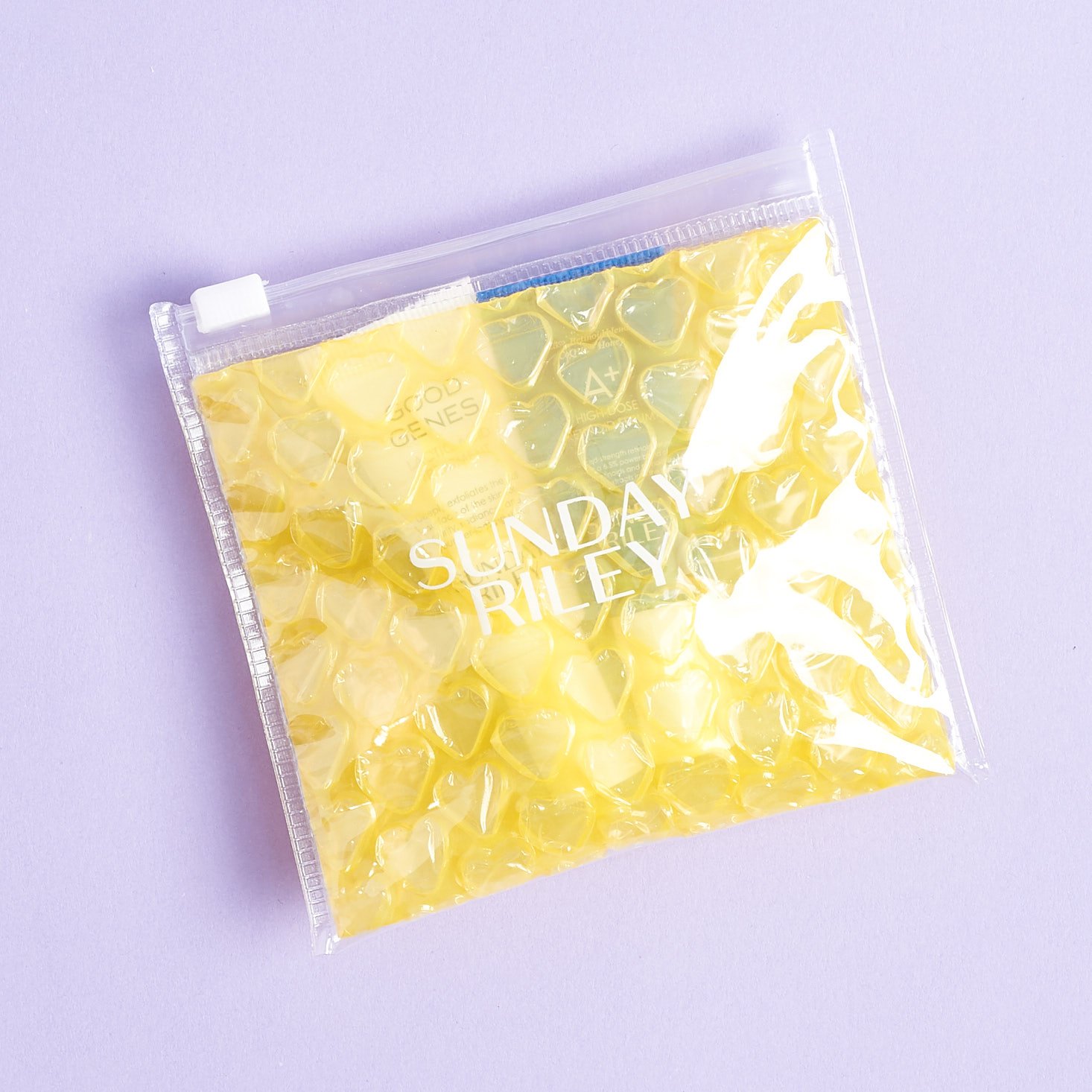 Yellow Sunday Riley pouch