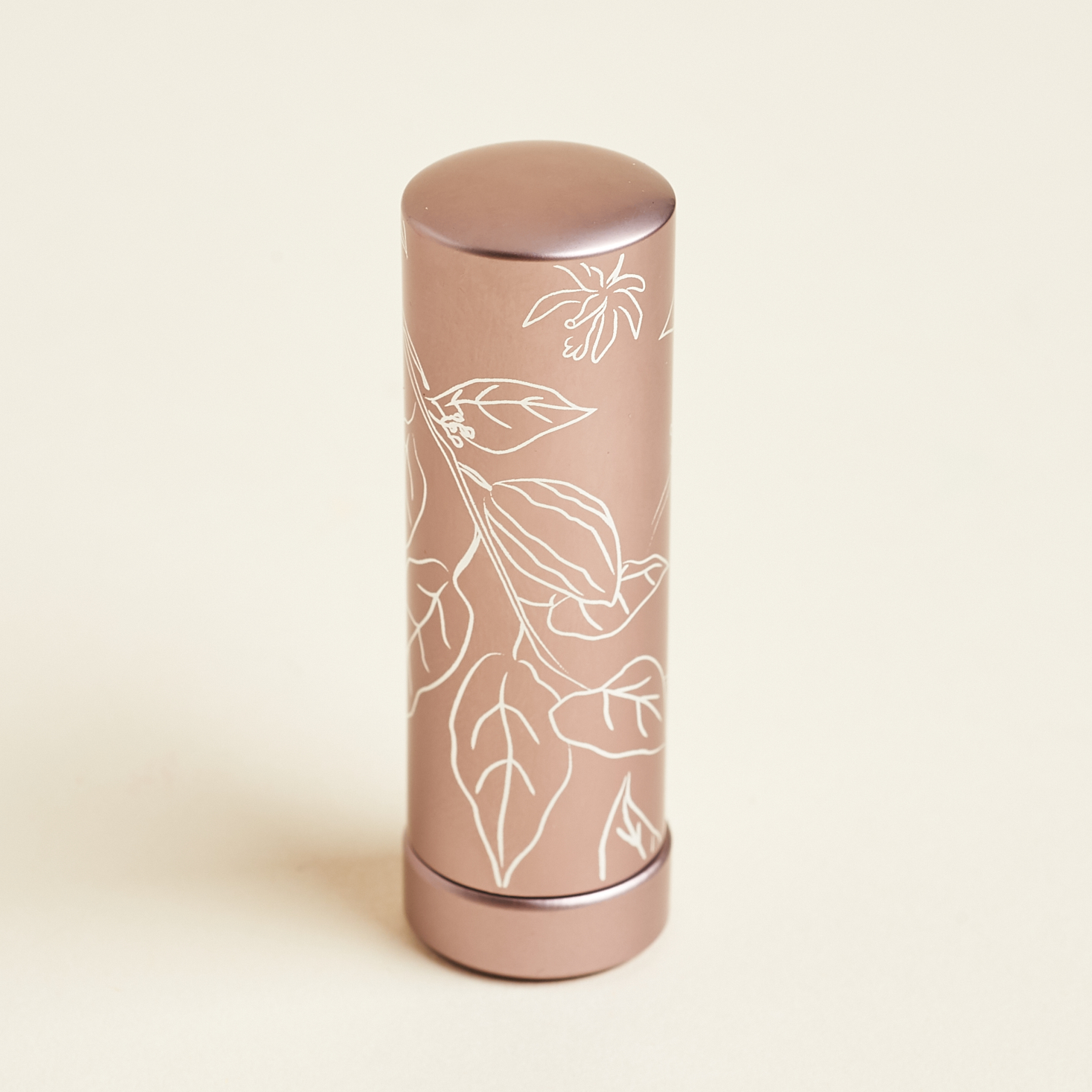 floral pattern on metallic lipstick tube