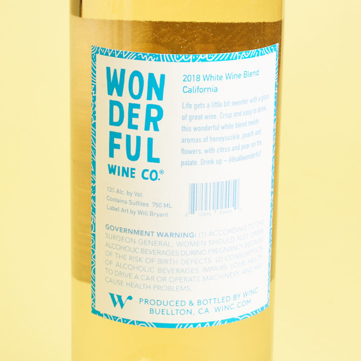 blue and white back label of the 2018 wonderful wine co. white blend