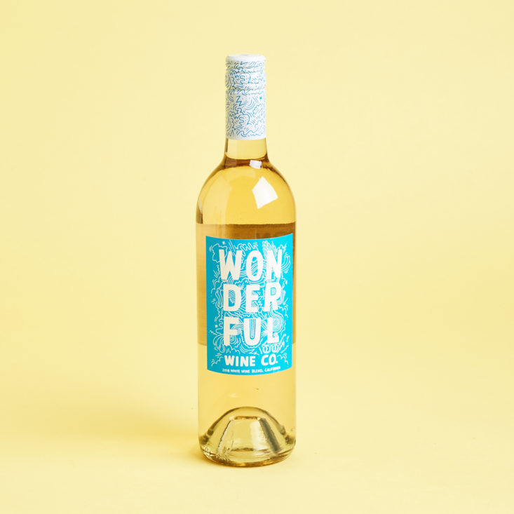 2018 wonderful wine co. white blend bottle pictured solo with a bright blue label, white block letters, and an illustrated design