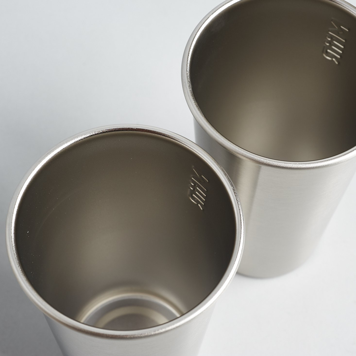 Looking down into 2 16 oz. Stainless Steel Pint Cups