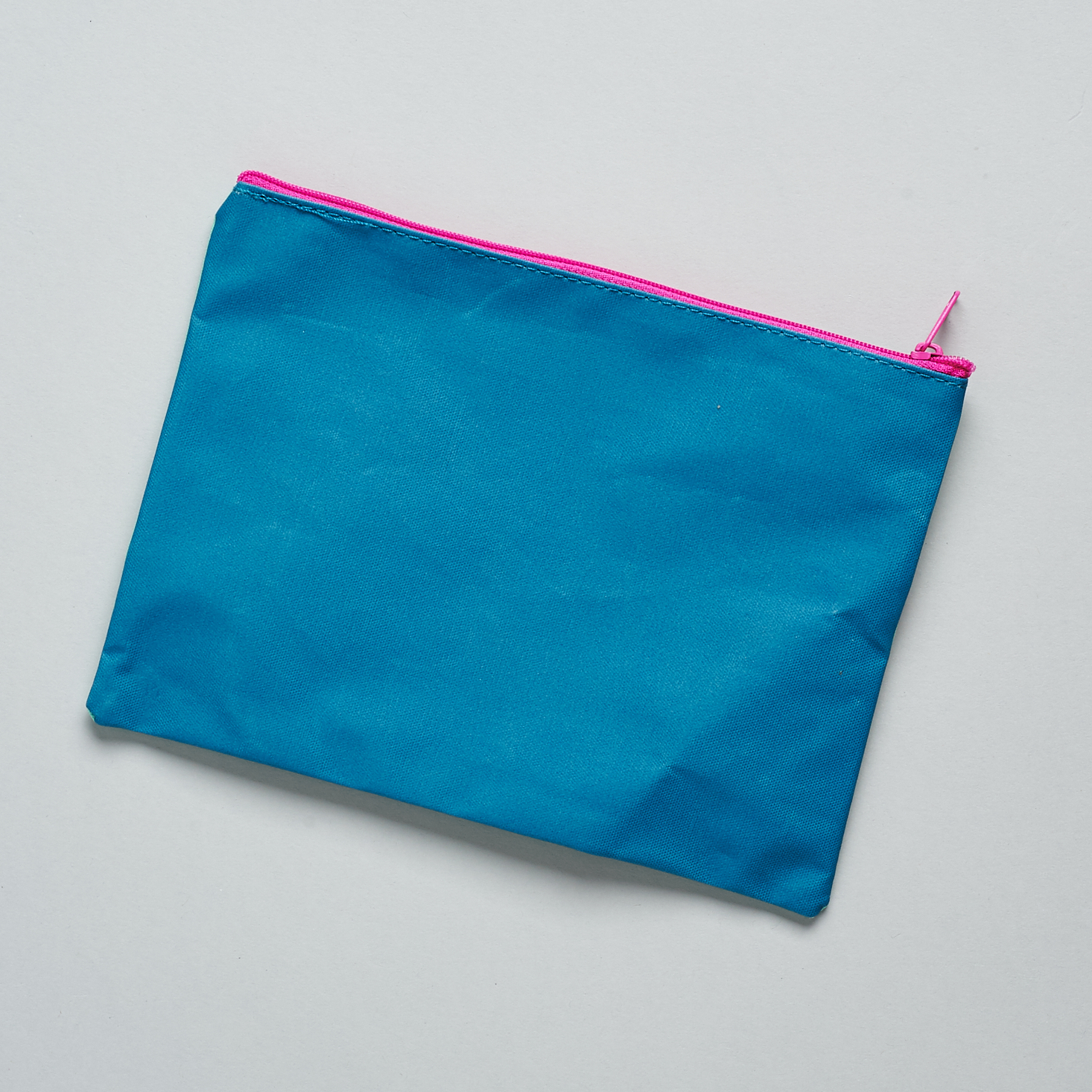 blue back of bag and pink zipper