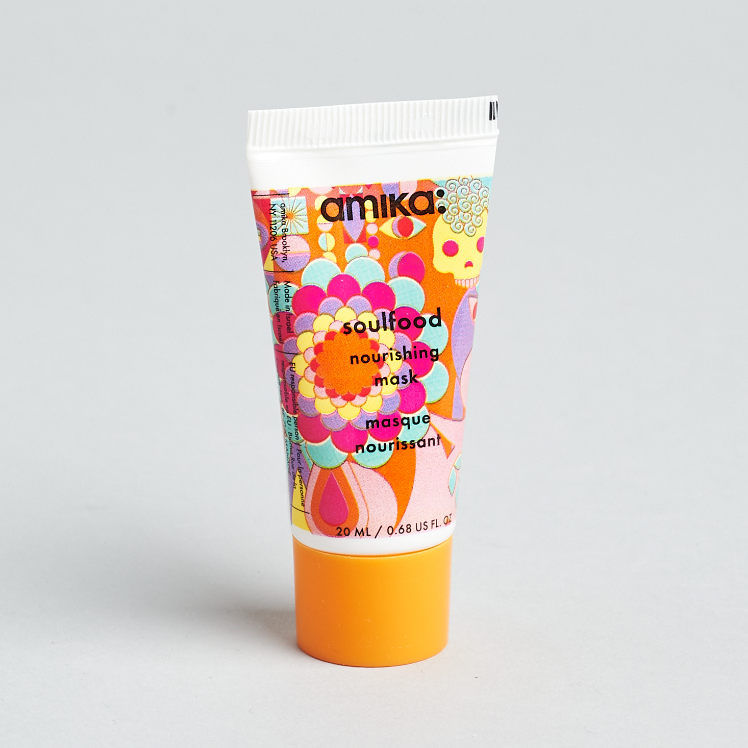 multicolor tube with orange cap