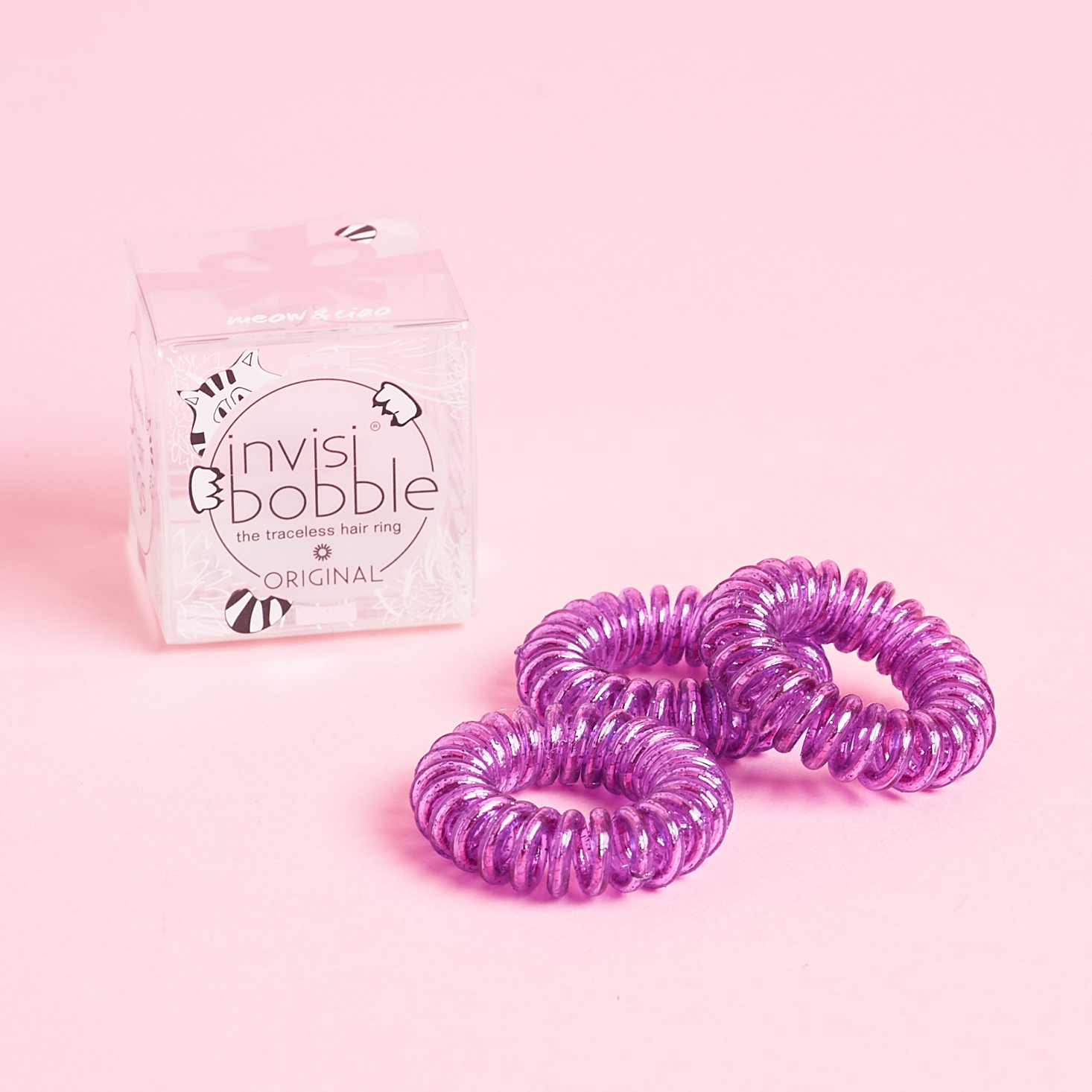 3 Purple Invisibobbles in front of box