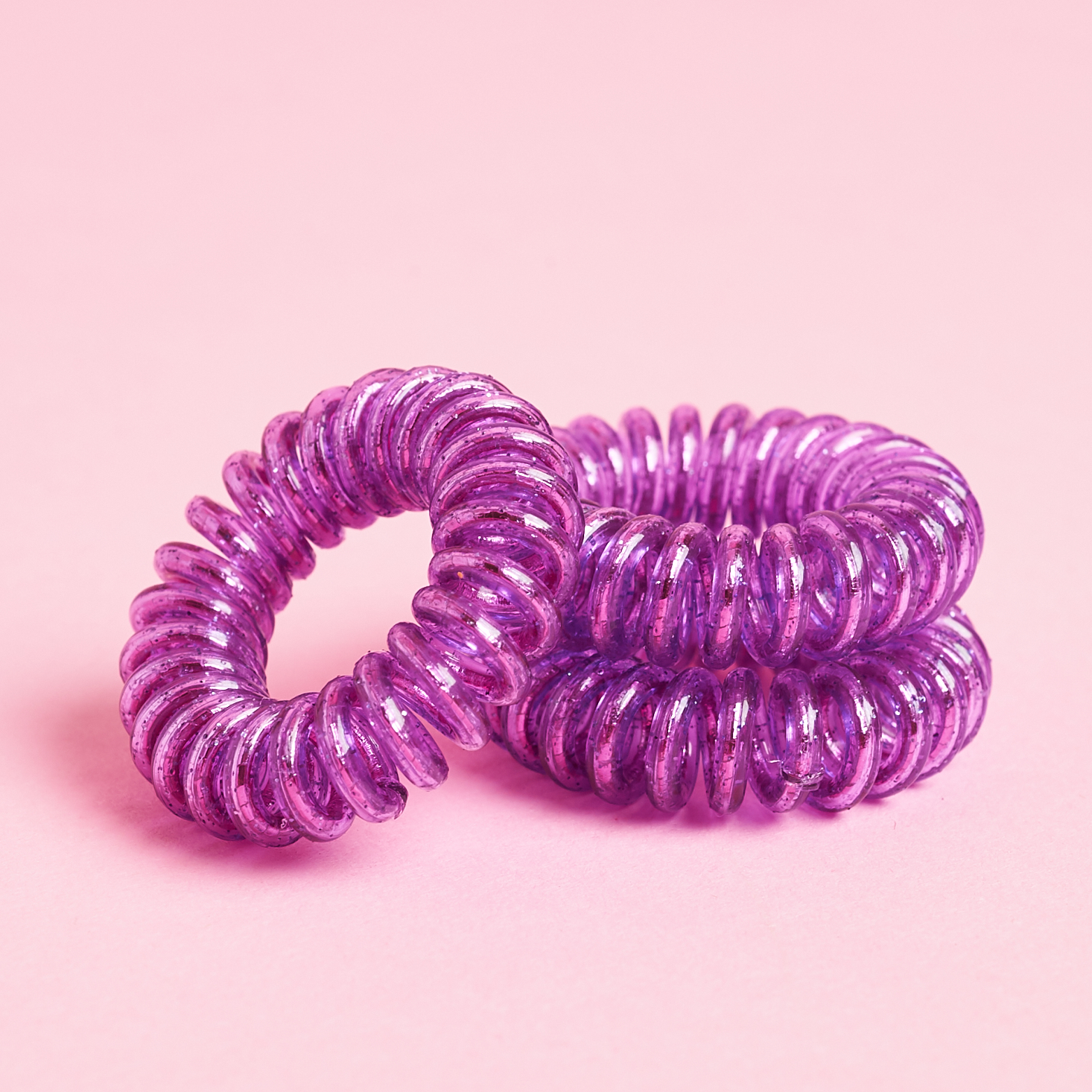 close up of 3 purple invisibobbles