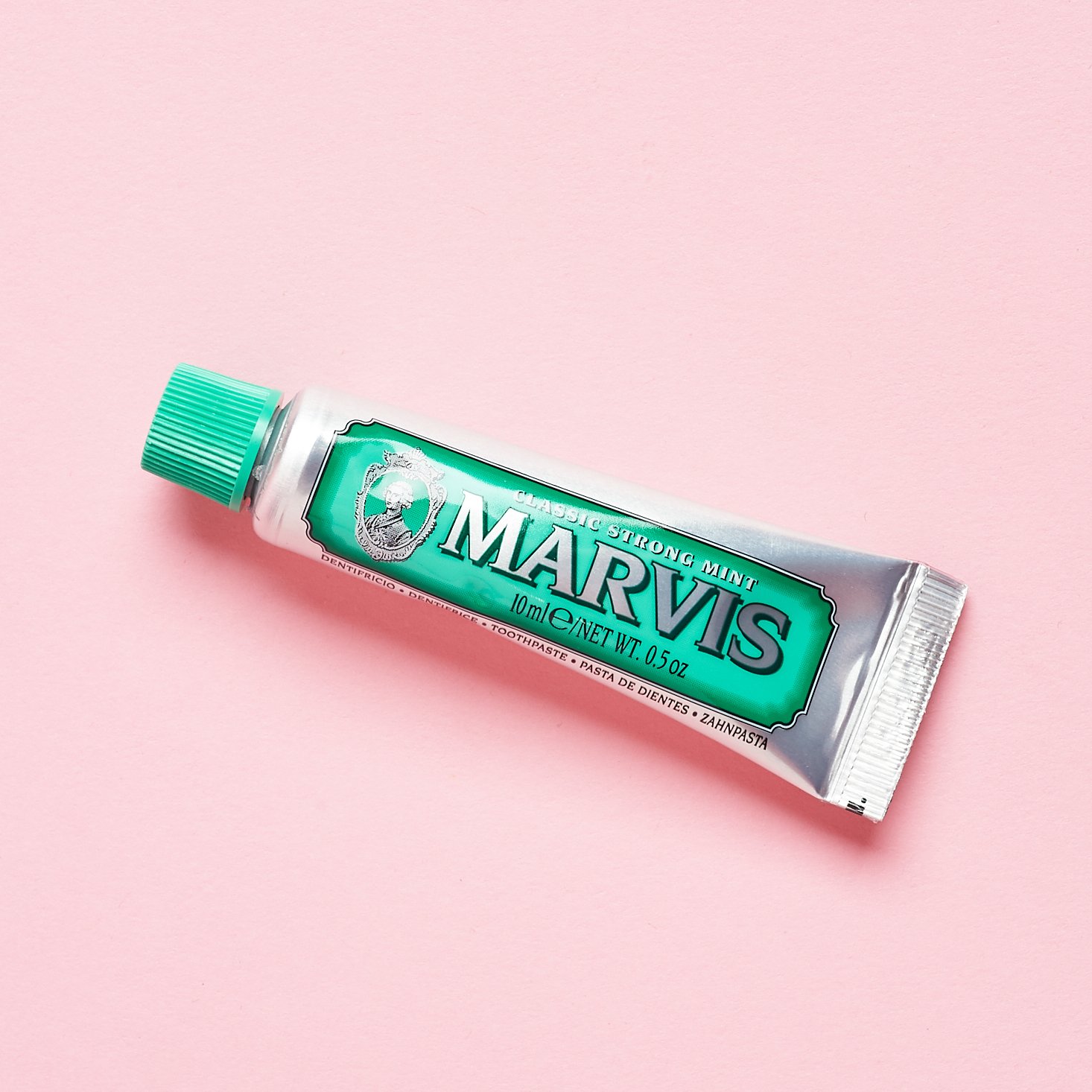 mini toothpaste tube in silver and green