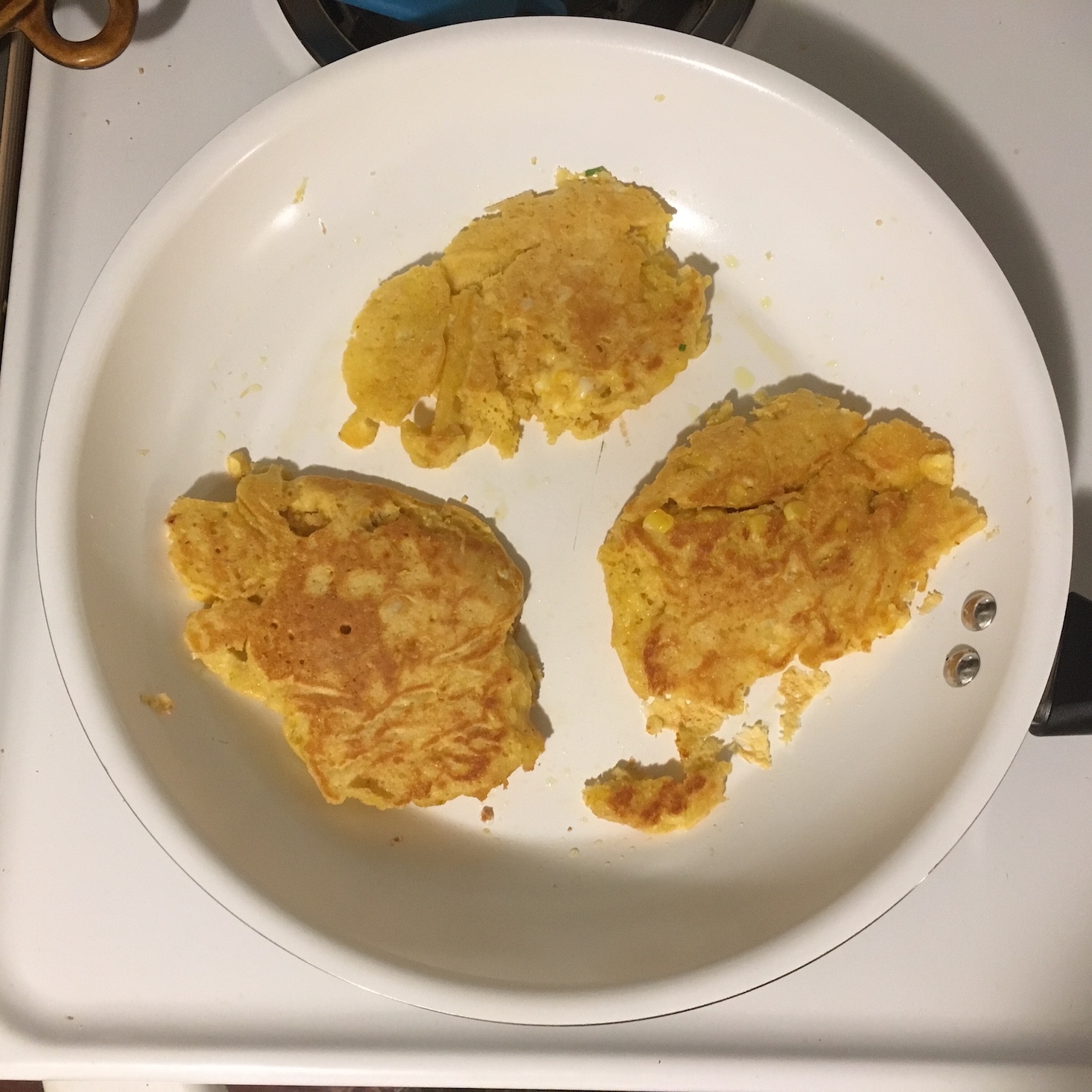 cajun shrimp and corn pancakes in the skillet