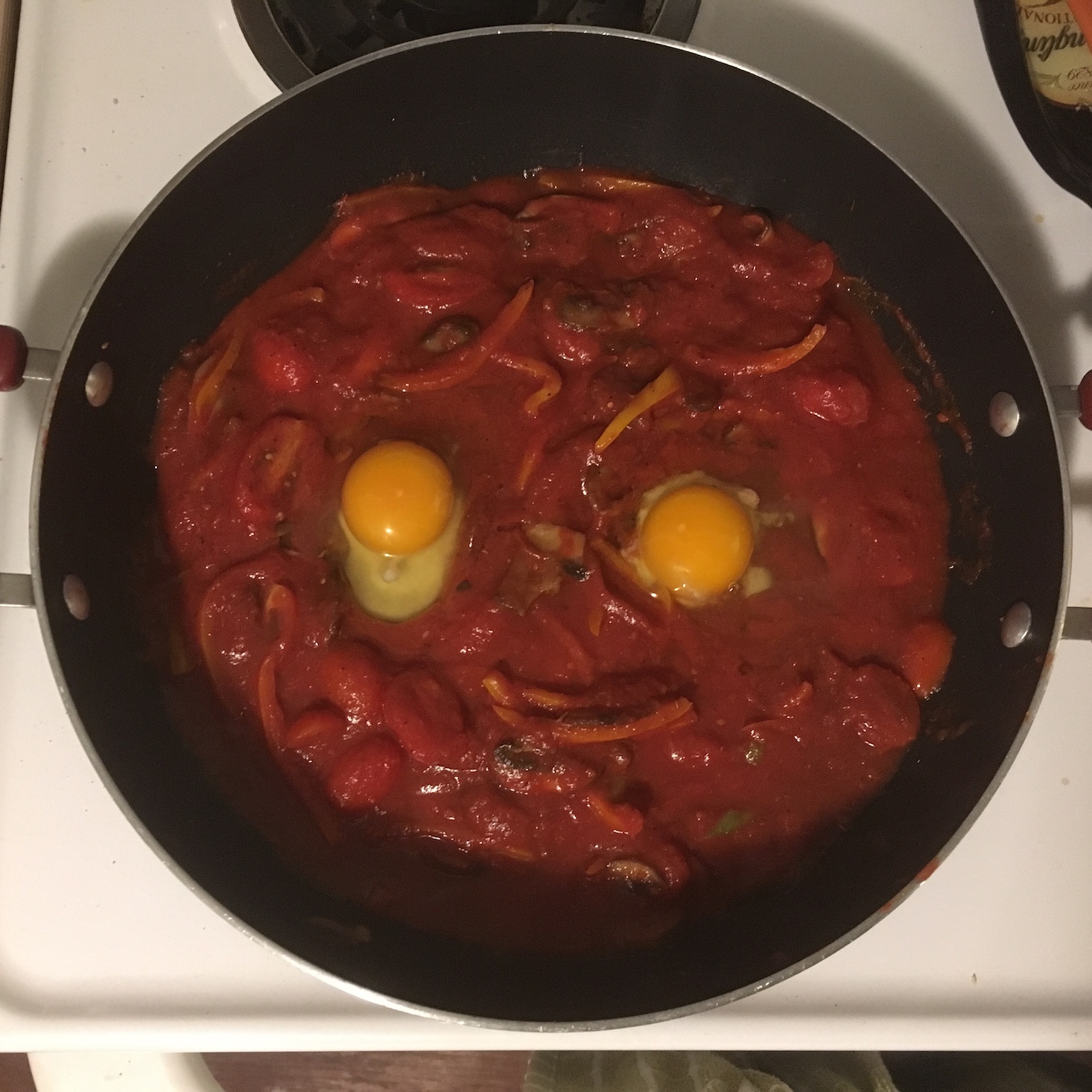 spicy egg and vegetable skillet eggs added to the pan