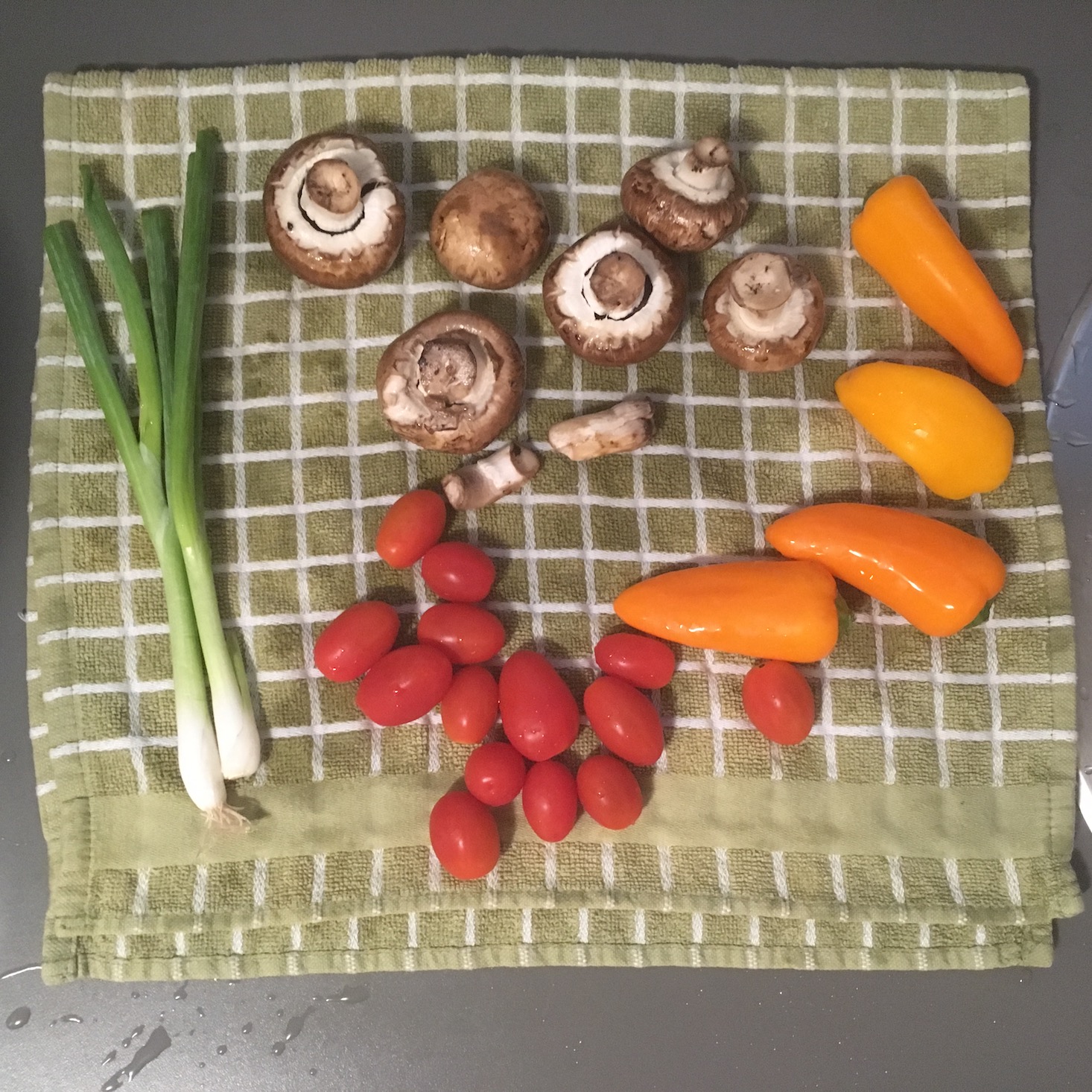spicy egg and vegetable skillet produce drying on a kitchen towel