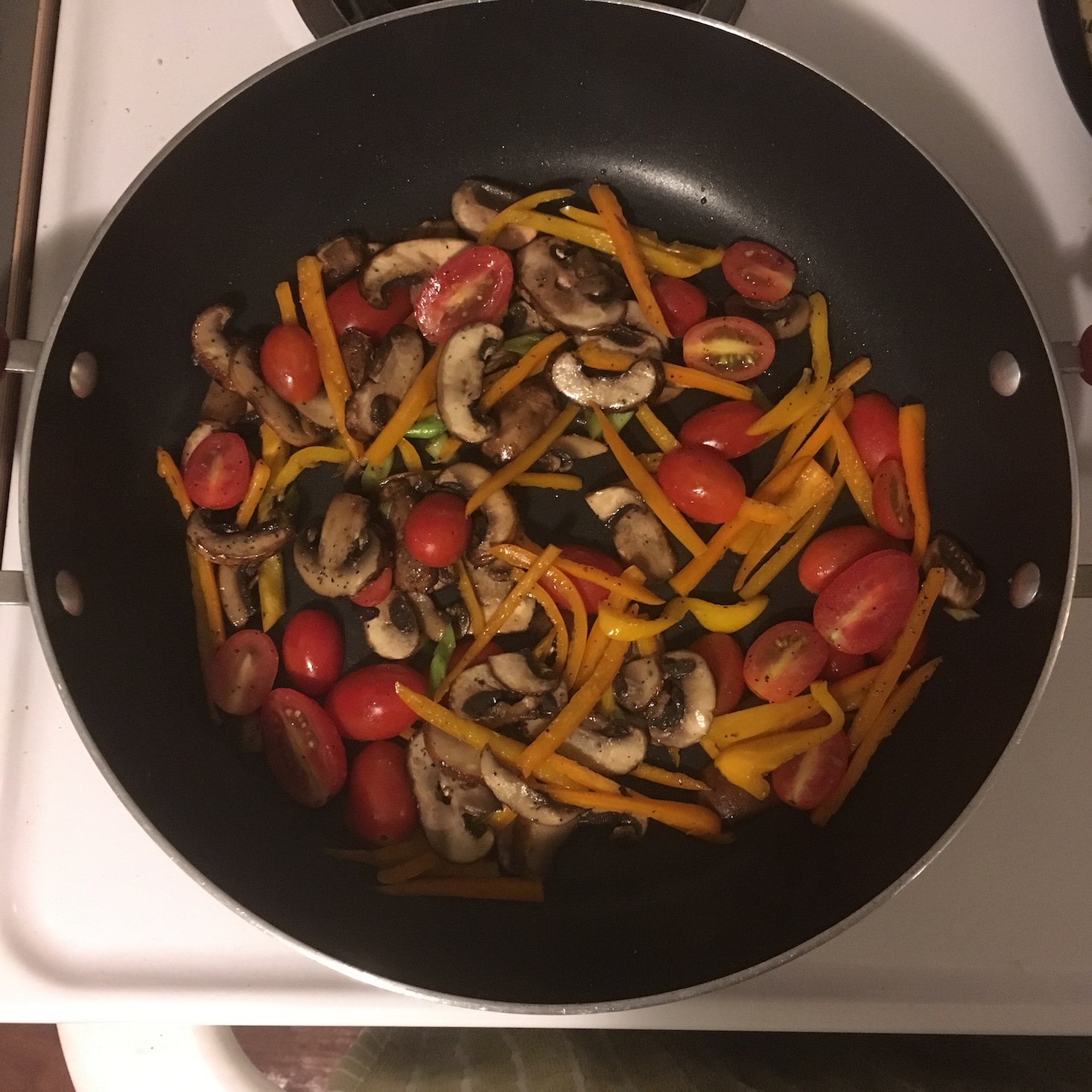 spicy egg and vegetable skillet tomatoes added to the pan