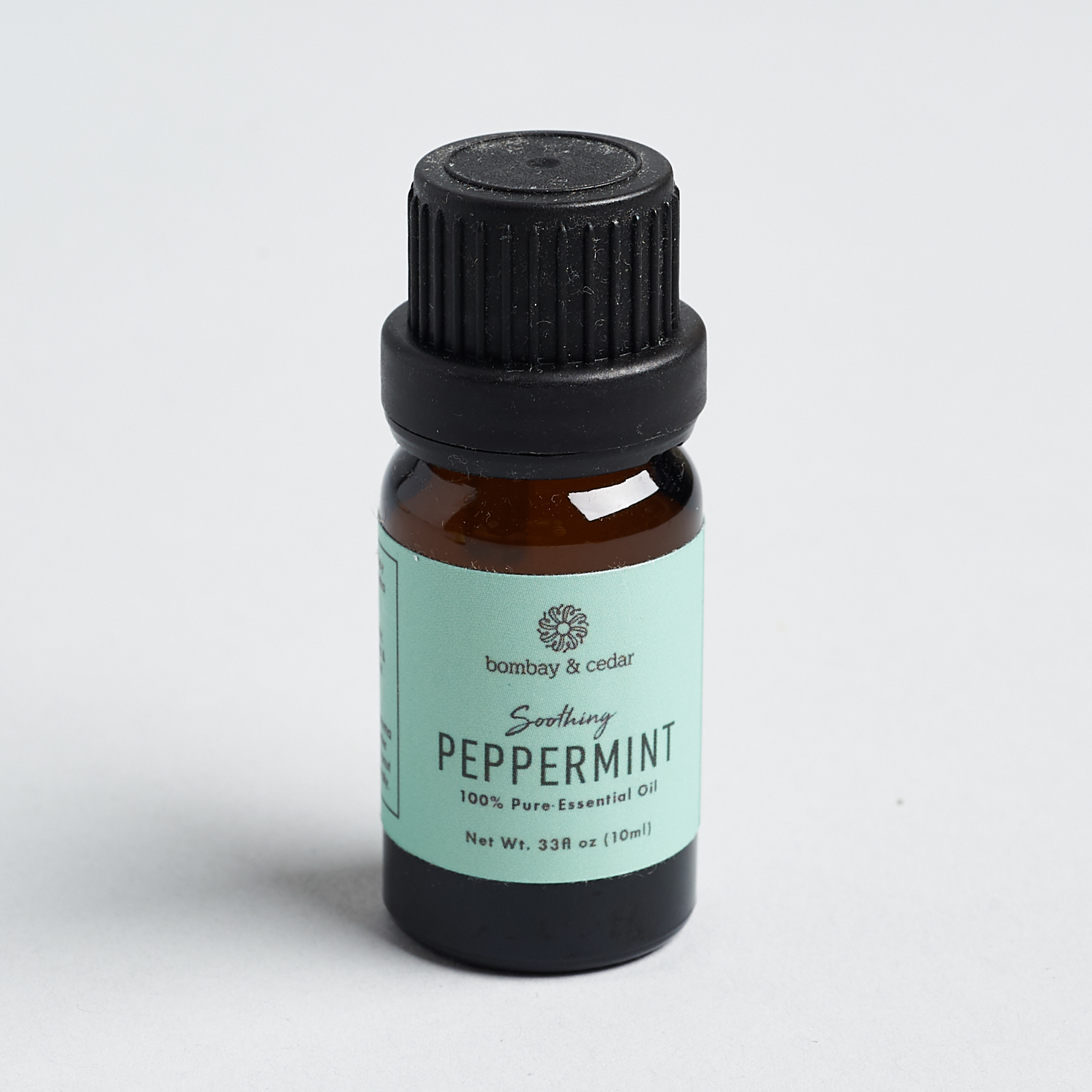 peppermint oil in amber glass bottle with robins egg blue label